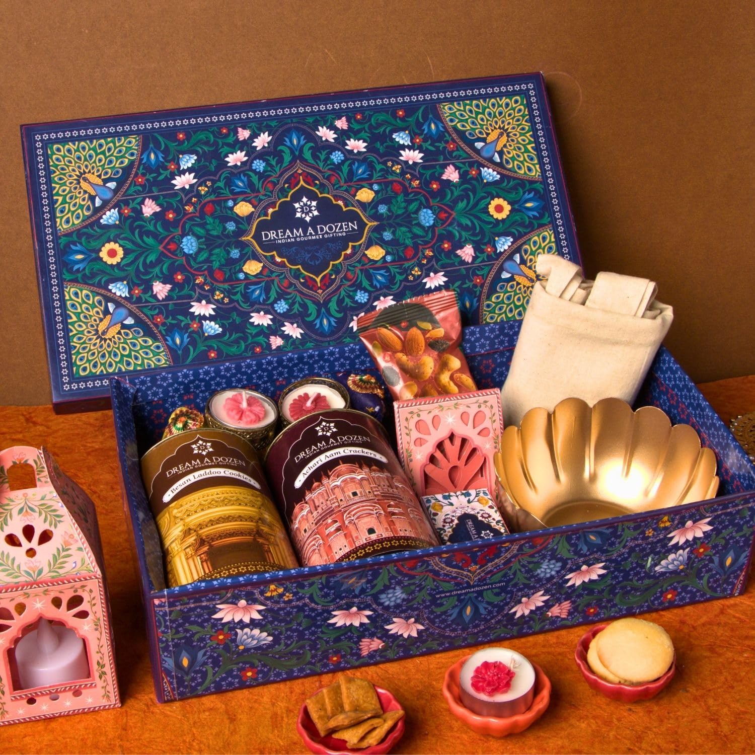 Dream a Dozen Midnight Magic Gift Hamper | Luxury Diwali Gift Box with Besan Laddoo Cookies, Achari Aam Crackers, Peri Peri Mixed Nuts, Indian Gourmet Chocolates, Functional Tote Bag, Auspicious Lotus Bowl, DIY Craft Lantern, Elephant Tealight Holders, Festive Candles & Greeting Card | Luxury Festive & Corporate Gift-image-38