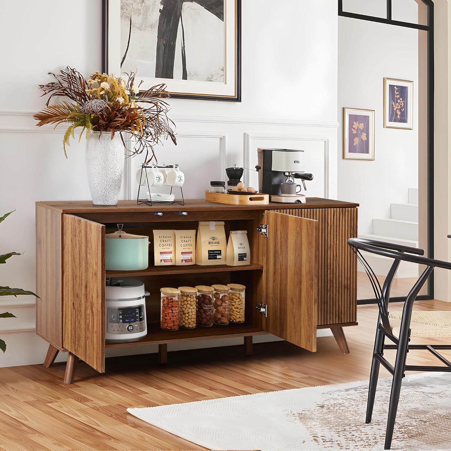 The cabinet interior filled with various kitchen items, demonstrating its large storage capacity.