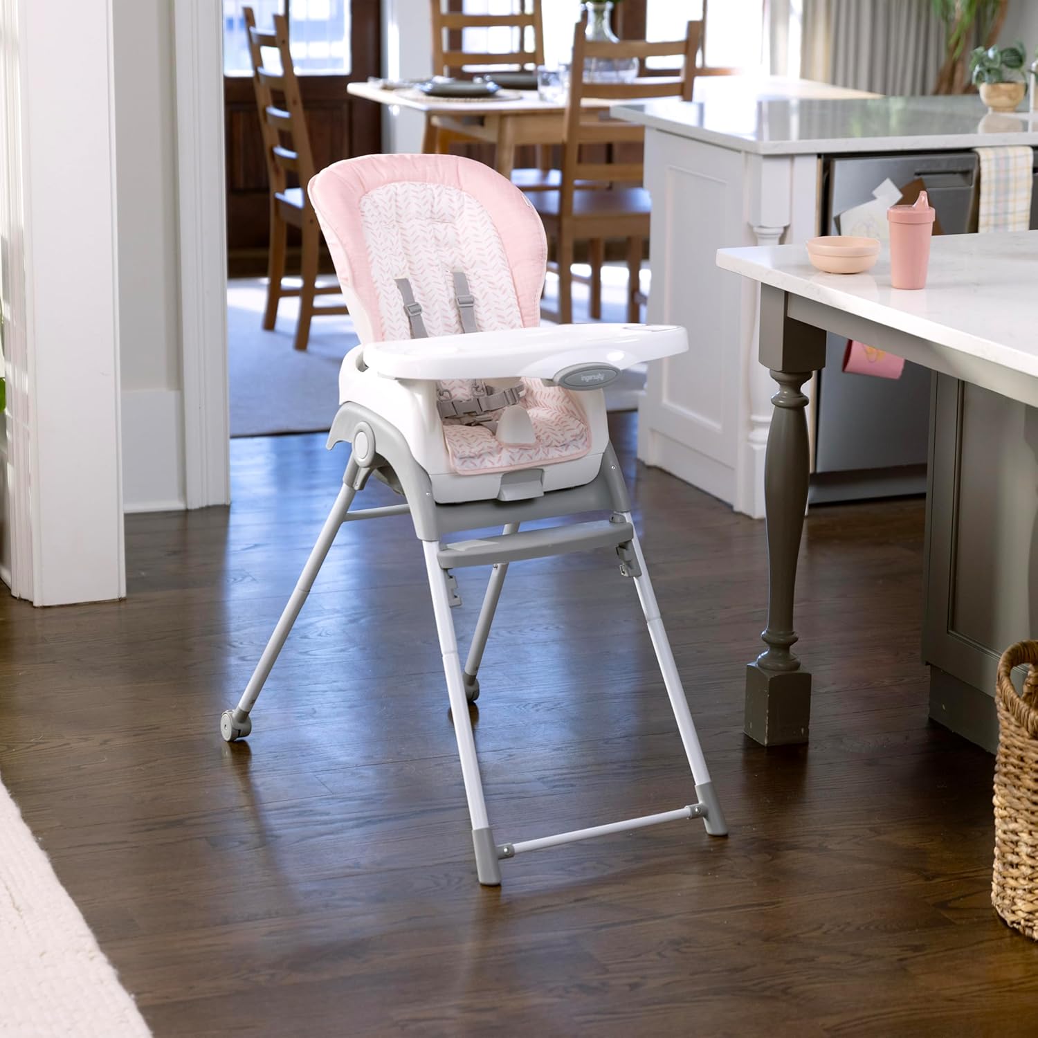 The Ingenuity Trio Foldaway high chair set up in a kitchen, ready for use.