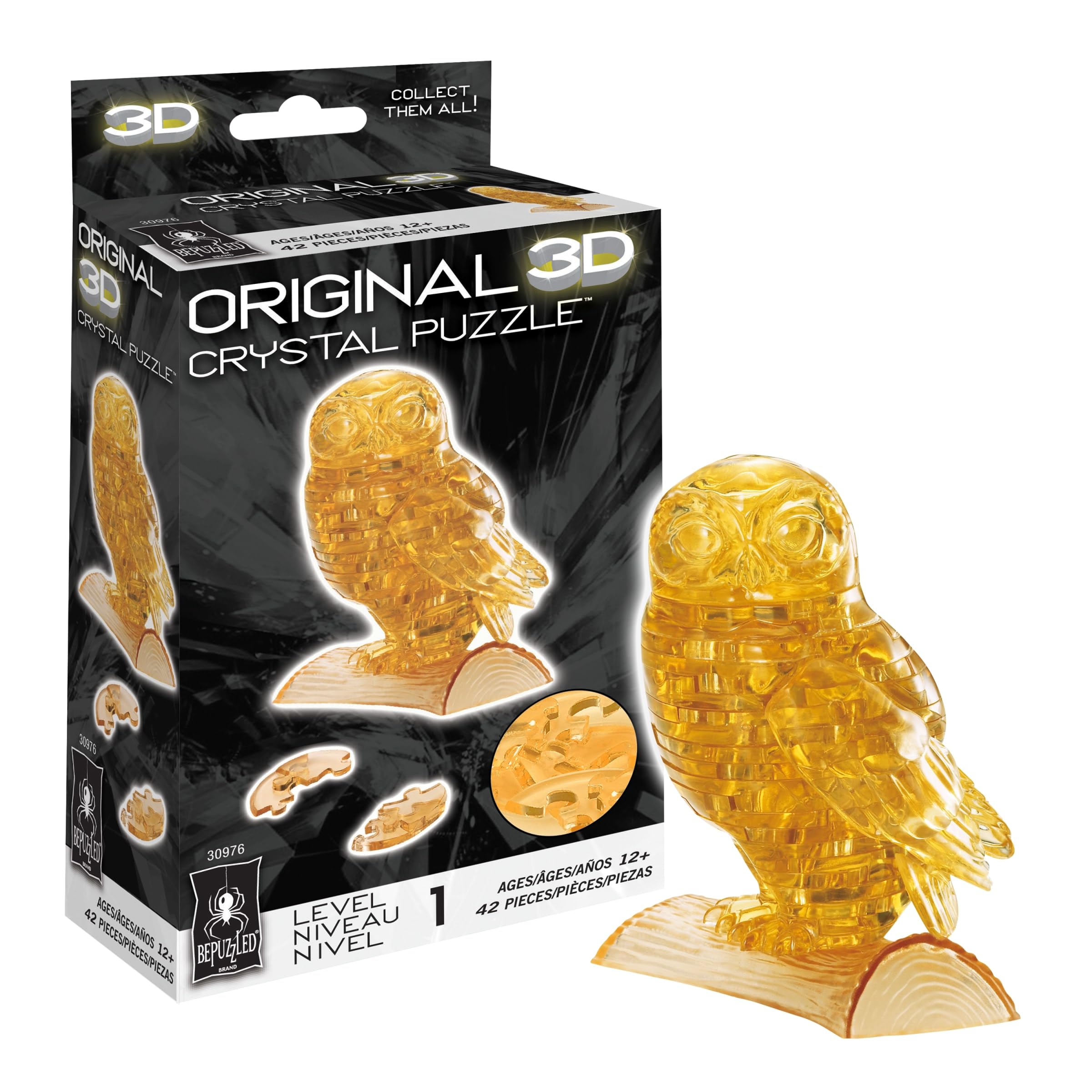 Completed Bepuzzled 3D Crystal Puzzle Owl, a translucent golden owl perched on a clear base.