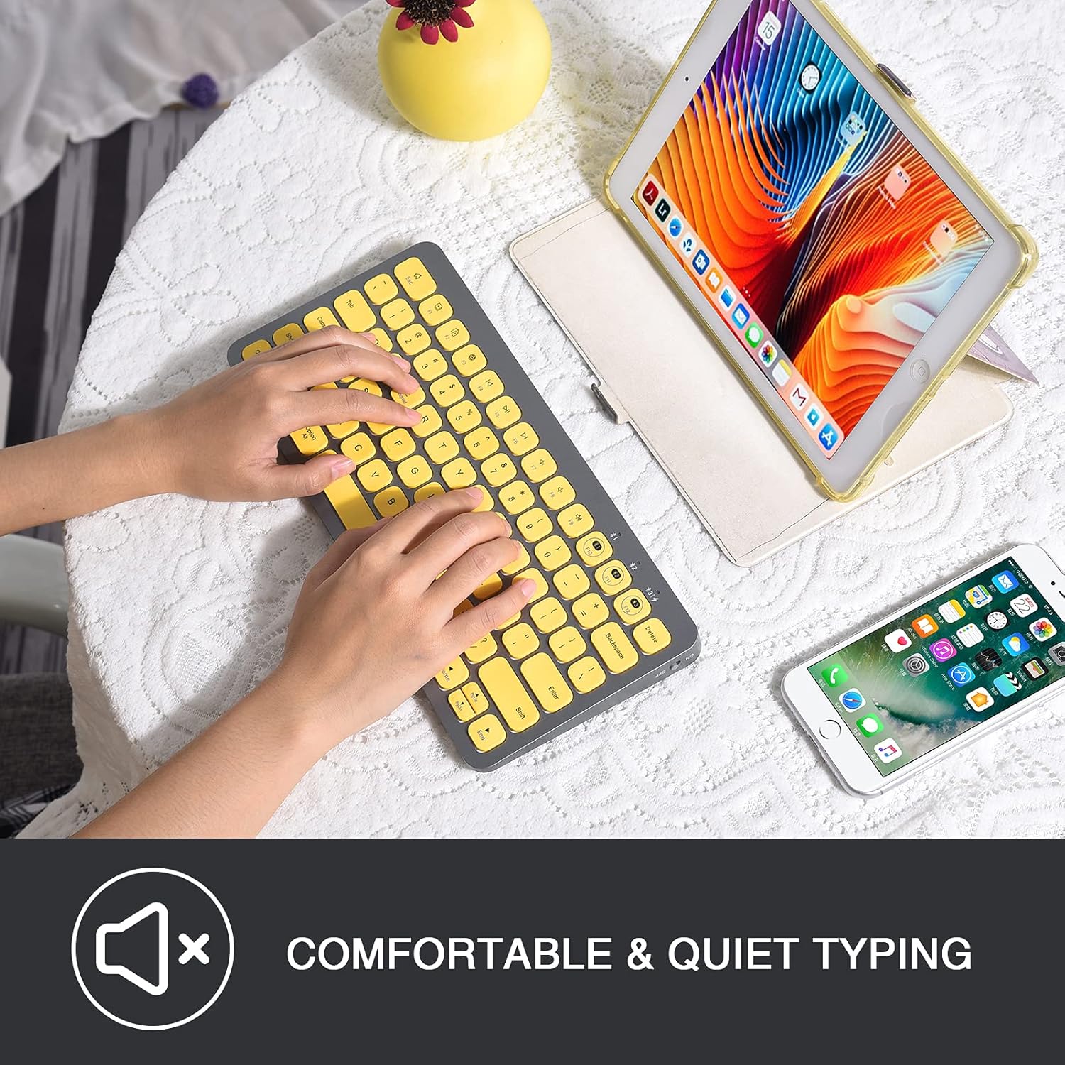 Hands typing on the PINKCAT keyboard