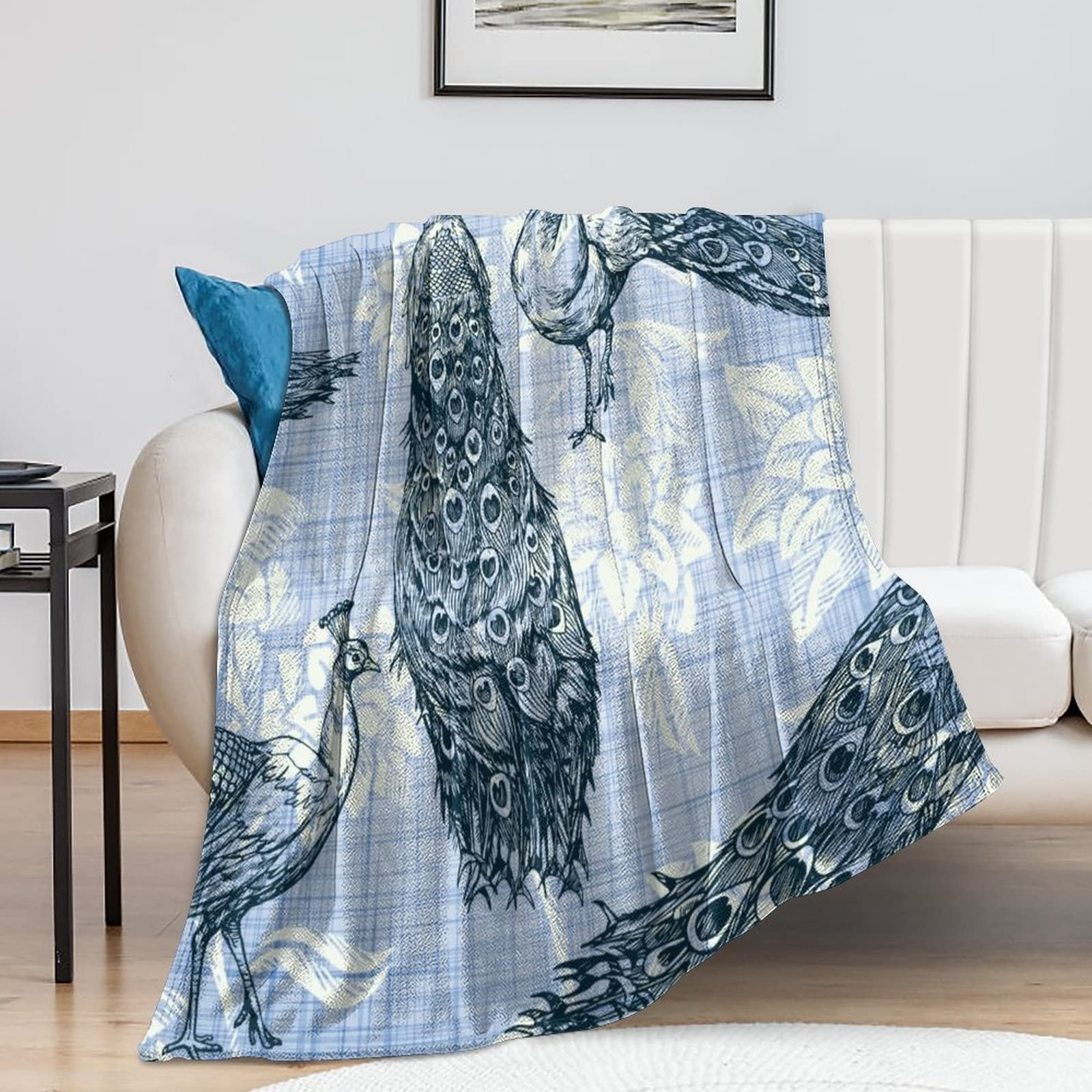 Couverture paon élégante en motif plume, le cadeau de pendaison de crémaillère idéal