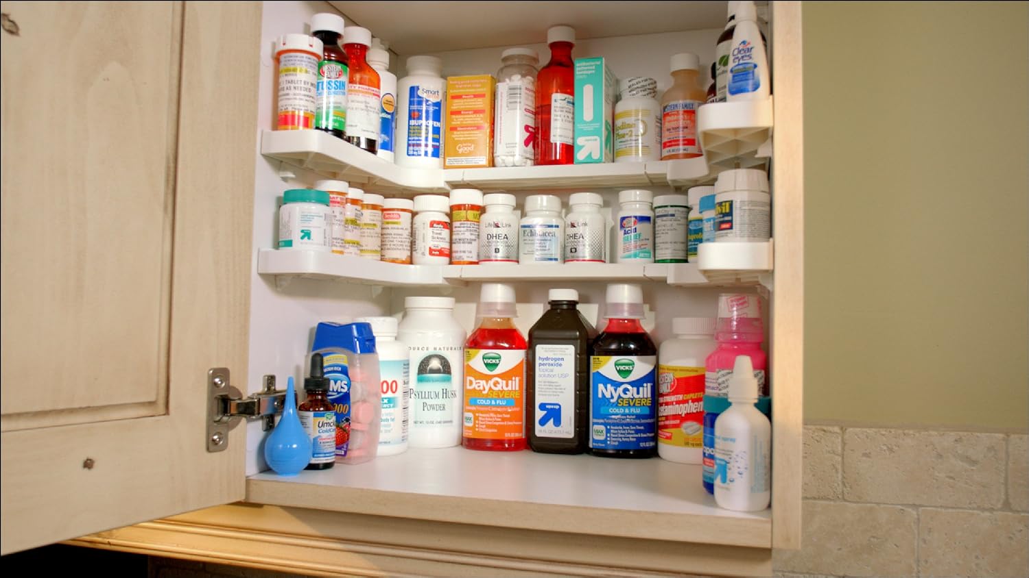 Medicine and supplement bottles organized on a Spicy Shelf Deluxe