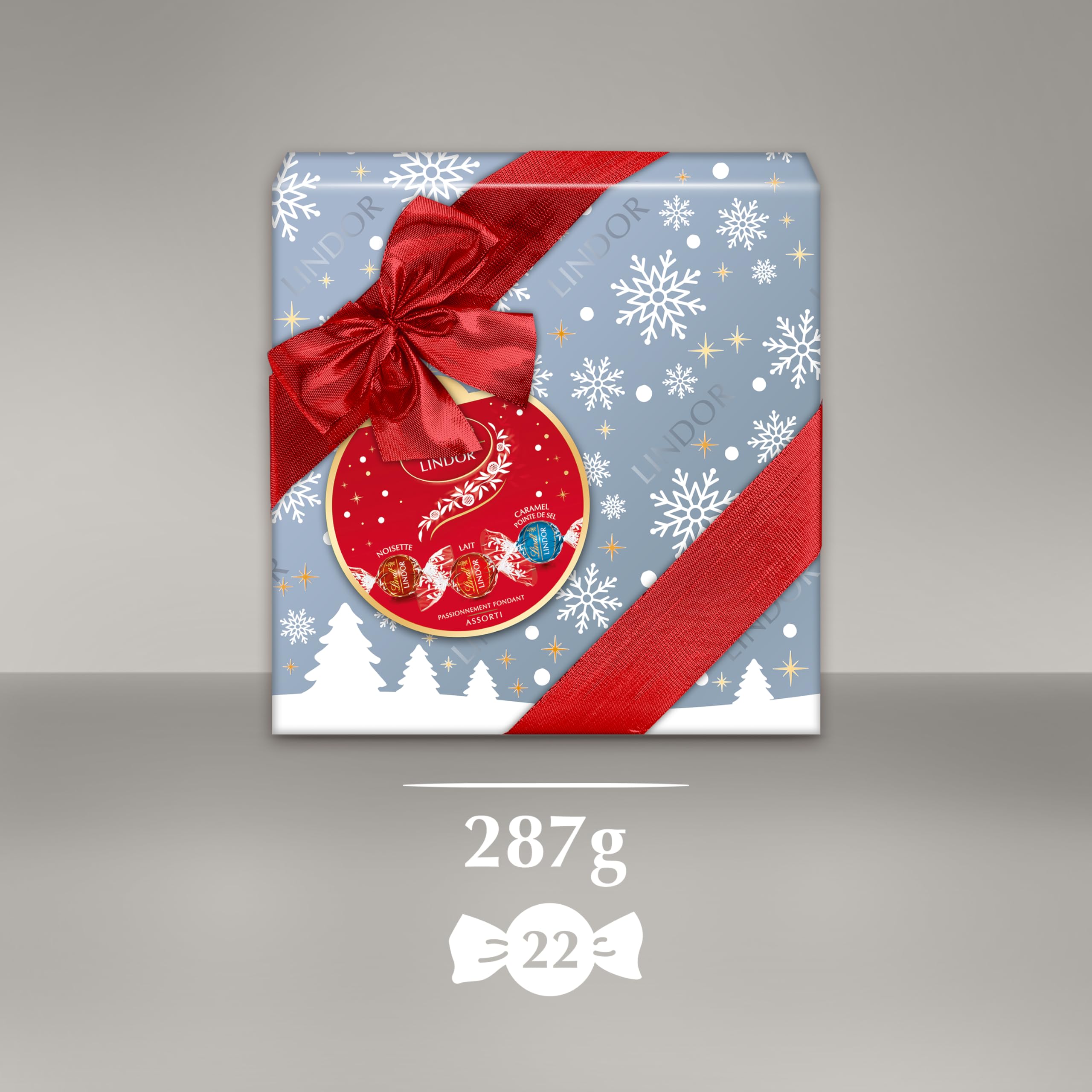 Lindt - Boîte Cadeau LINDOR - Assortiment de Chocolats au Lait, Noisettes, Caramel Pointe de Sel - Cœur fondant - Idéal pour Noël, 287g