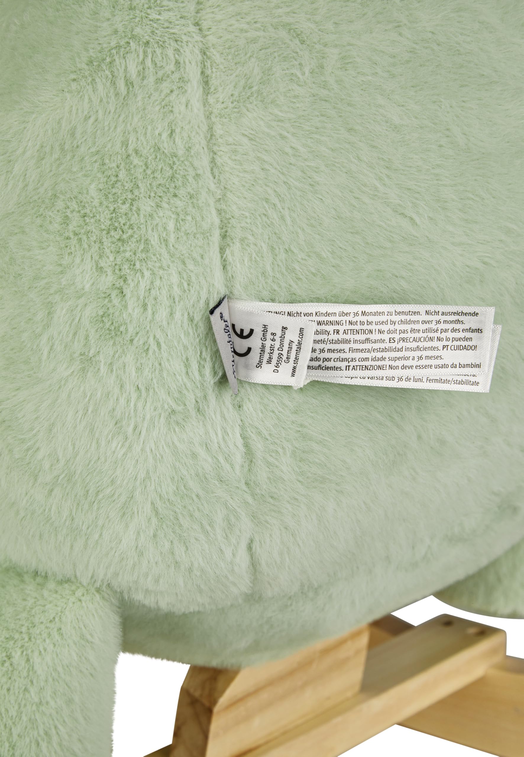 Sterntaler Schaukeltier Dino Rexi - Schaukeltier aus kuscheligem Plüsch und weicher Sitzfläche - Schaukelpferd für Kinder - Spielzeug Wippe für Baby und Kinder, pudergrün