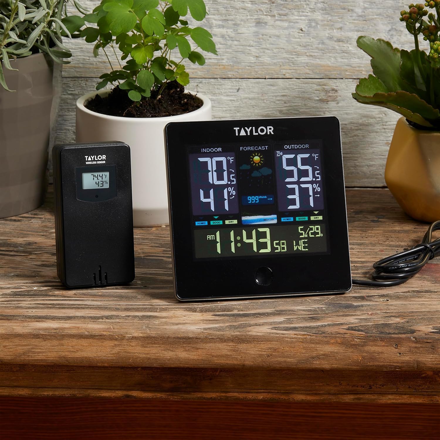 Close-up of the Taylor Multi-Functional Device and wireless sensor, showing the USB power cable connected to the main unit.