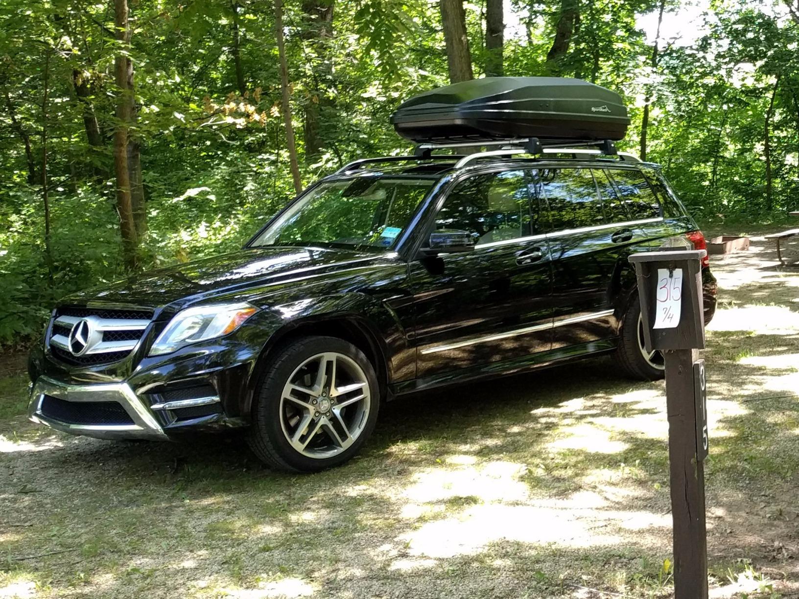 SportRack Vista XL roof cargo box loaded for a family camping trip