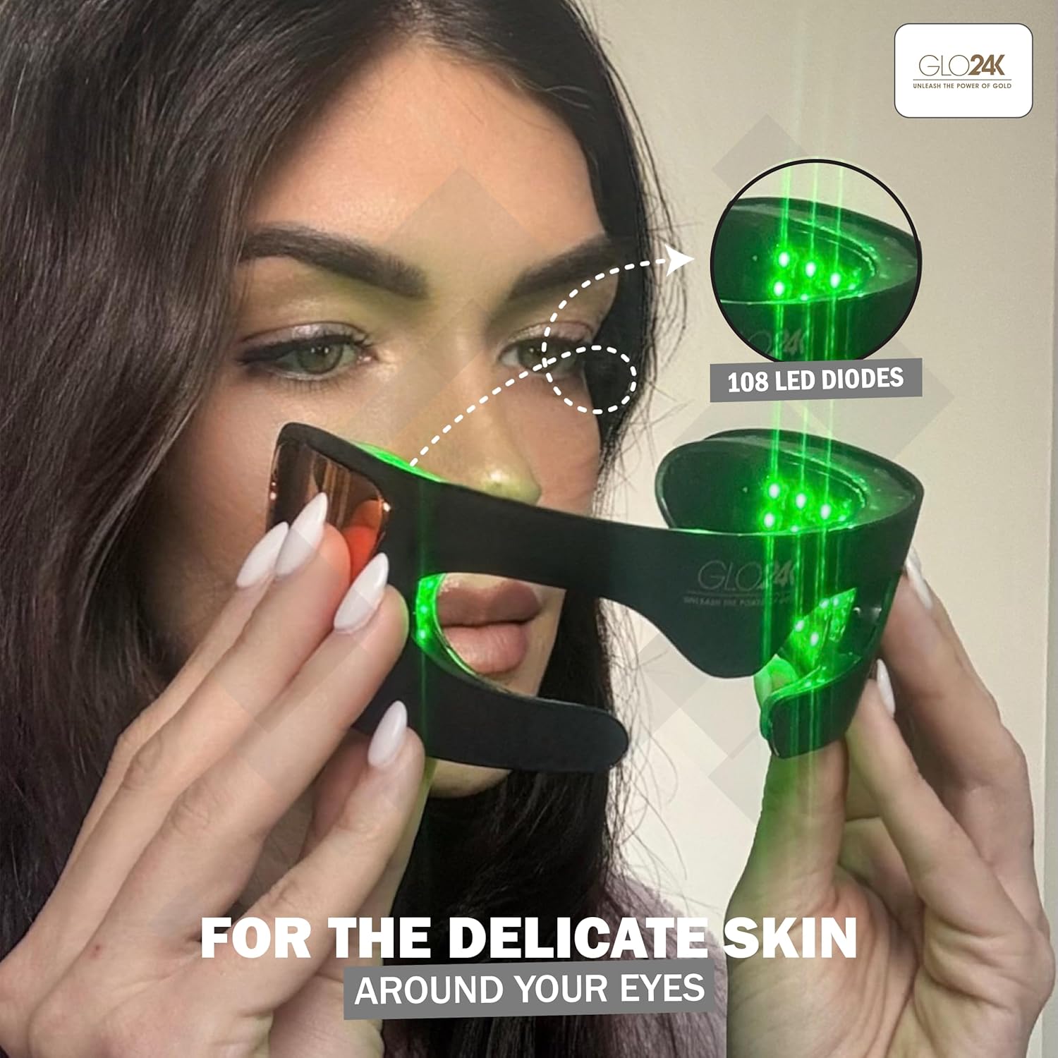 Woman wearing GLO24K Bionic 7 Color LED Eye Care Mask with green light active, showing 108 diodes