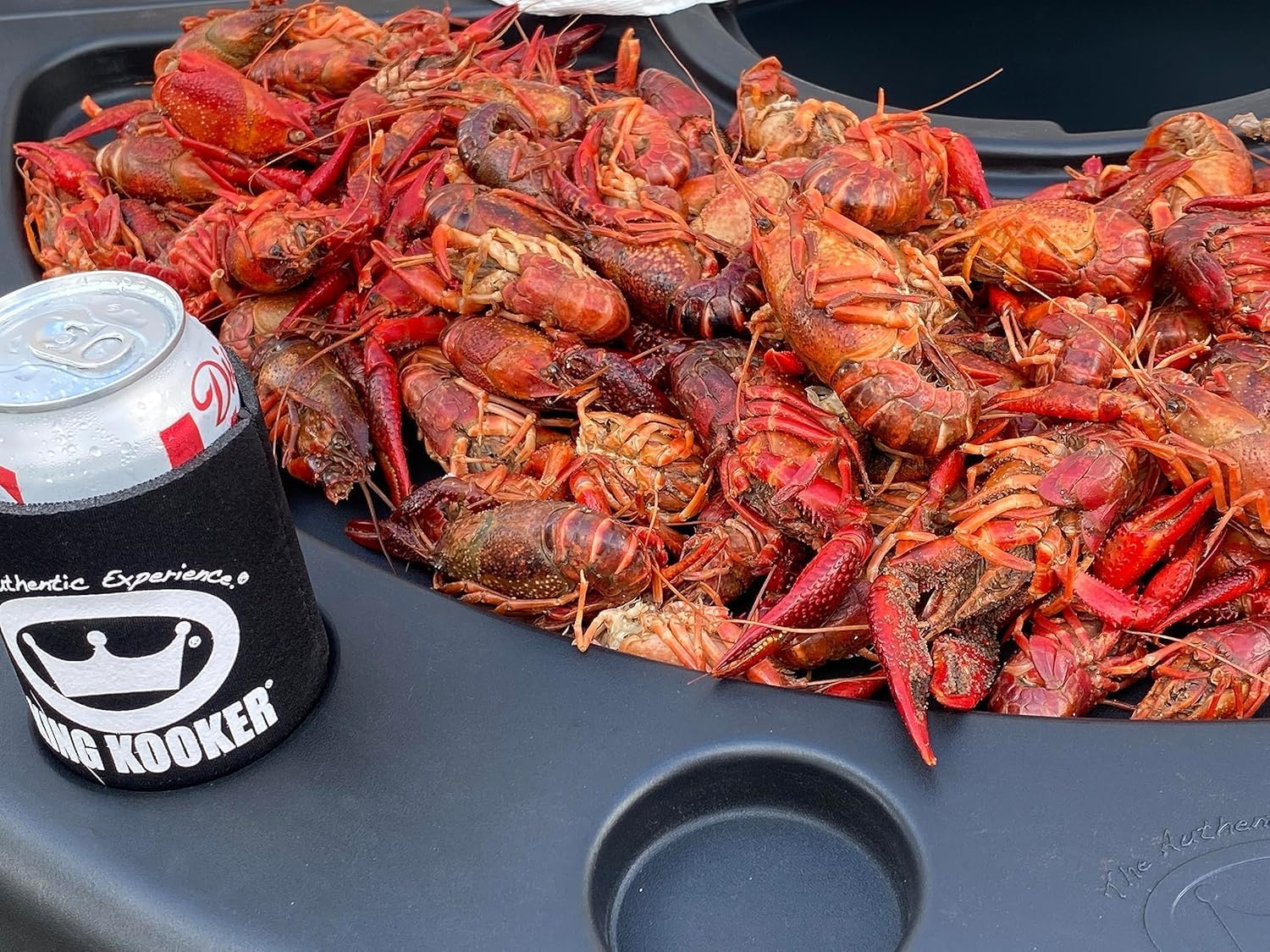 King Kooker Plastic Seafood Serving Table. 42" Diameter and 38" Max Height. Fold Out Legs. Three Height Adustments. Includes Two Paper Towel Holders, Beverage Can Place Holders. Easy to Clean.