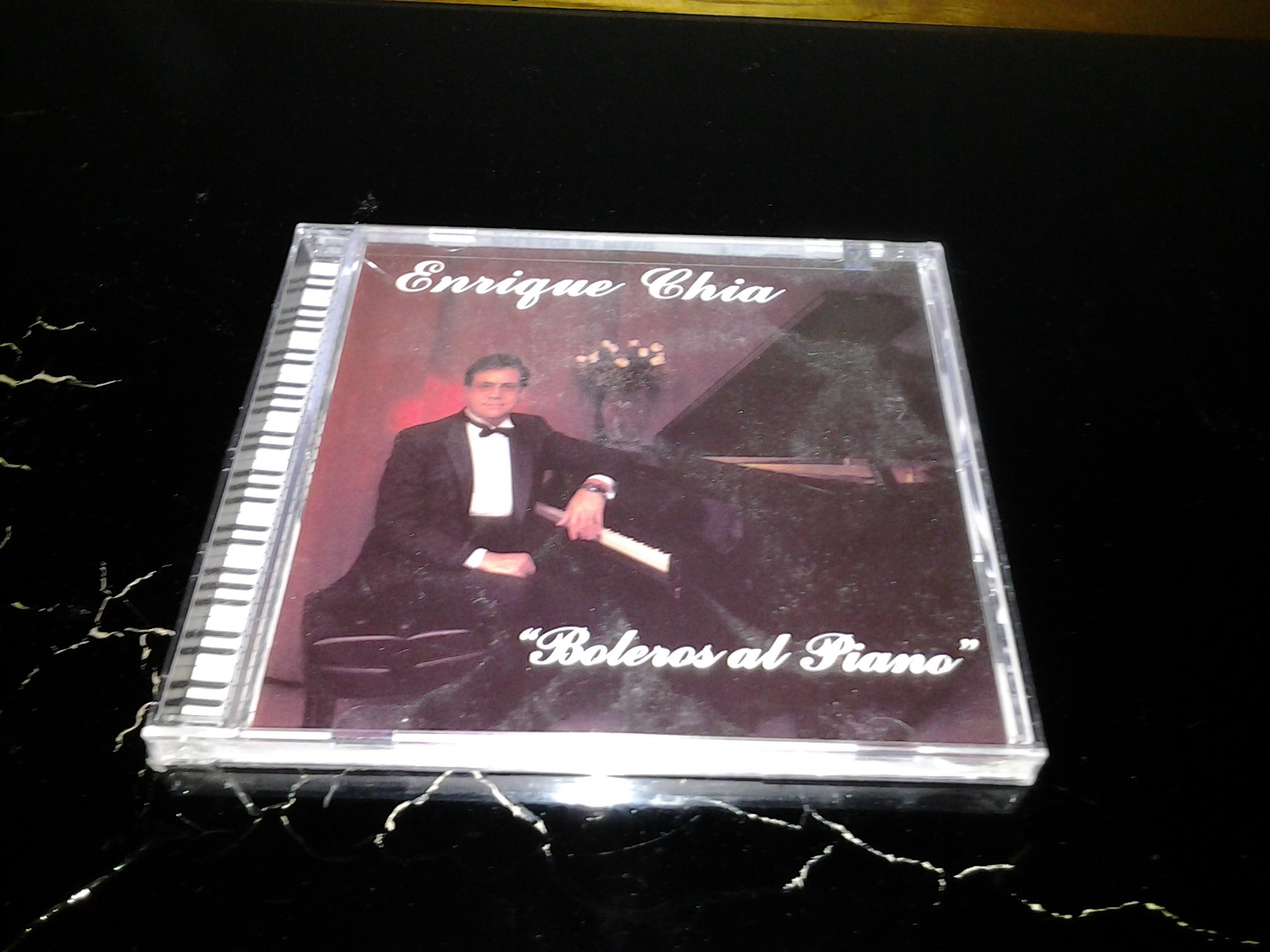 Boleros Al Piano [Audio CD] Enrique Chia; Rene Toledo; Luis de la Torre; Manny L pez; Orlando Jr. Hernandez; Orlando Hernandez and Nelson Flaco Padron