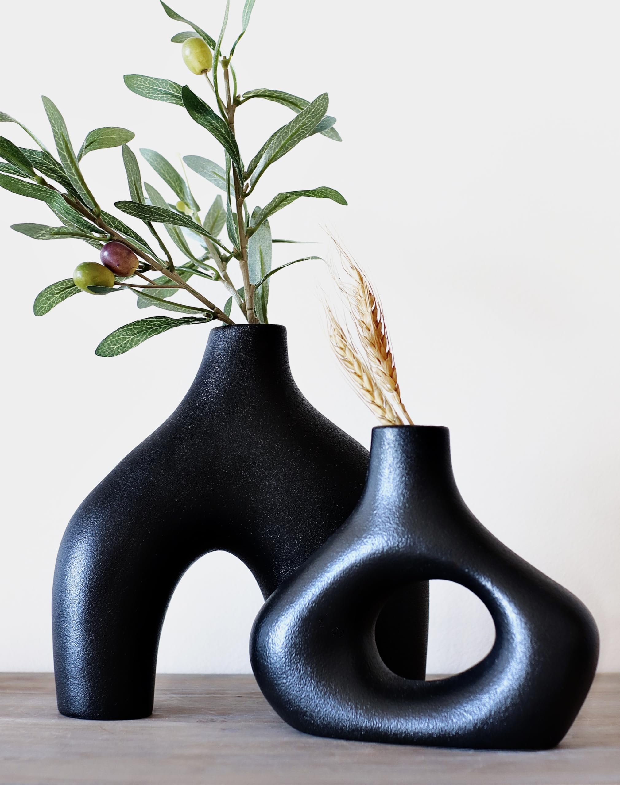 Carrot's Den Black Ceramic Modern Vase Set of 2, Donut Shelf Decor, Black | Pair for bookshelf and bookcase decor, mantel styling, or home staging. Holds dried stems and faux plants indoor.
