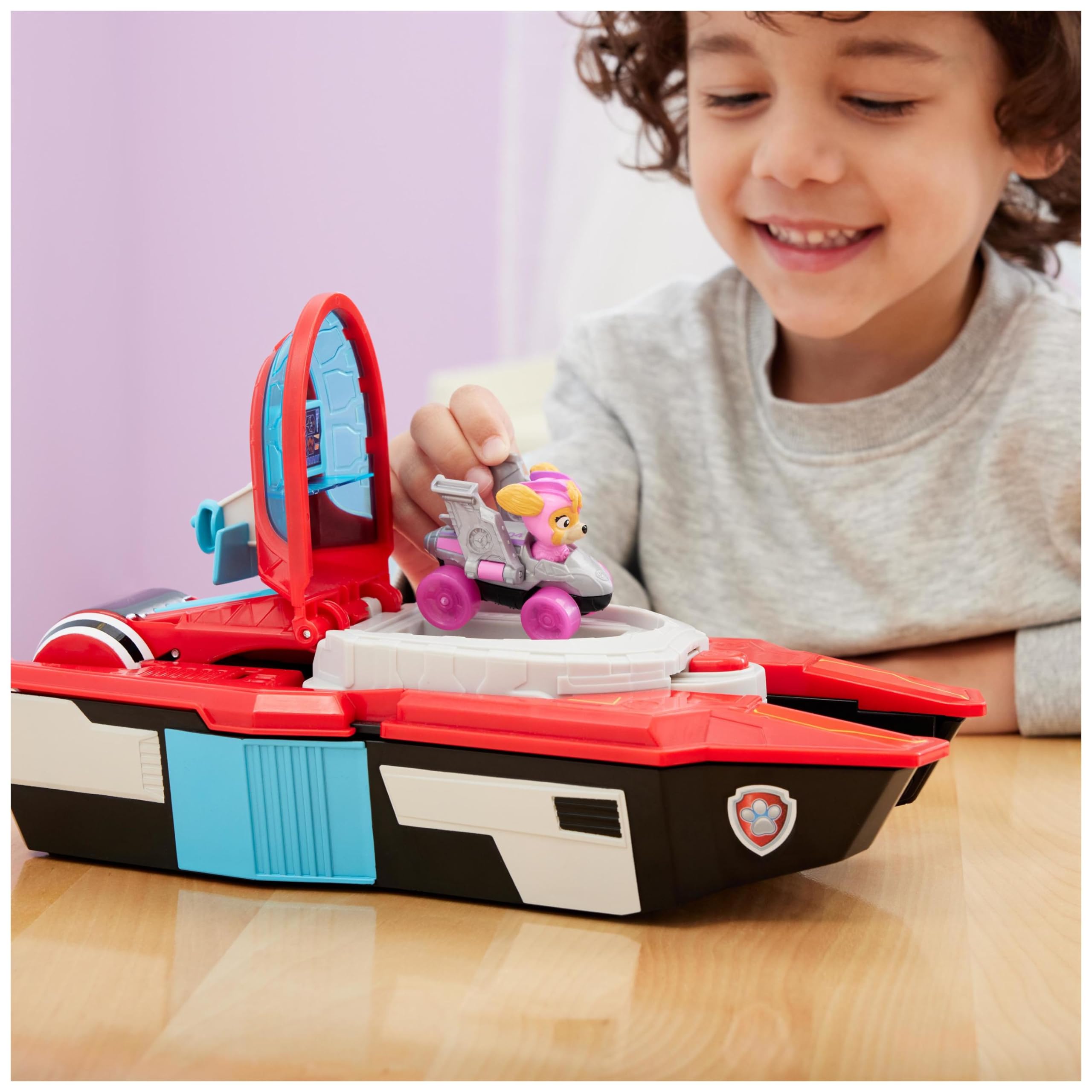 Paw Patrol: Il Super Film, Giocattolo Pup Squad Aircraft Carrier HQ Trasformabile con Personaggio Chase e Pup Squad Racer di Skye, Giocattoli per Bambini e Bambine, 3+ Anni