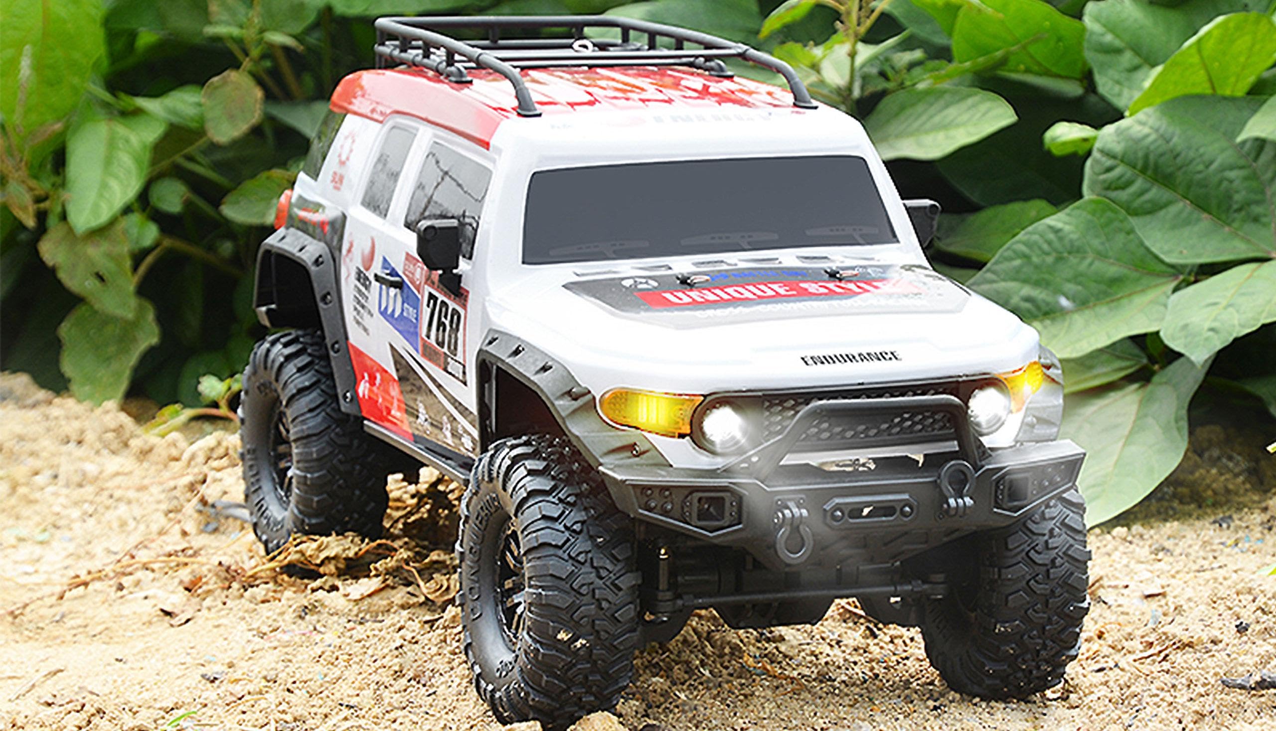 Amewi 22592 Dirt Climbing SUV Race Crawler 4WD 1:10 RTR biały/czerwony, w zestawie pilot zdalnego sterowania, akumulator, kabel do ładowania