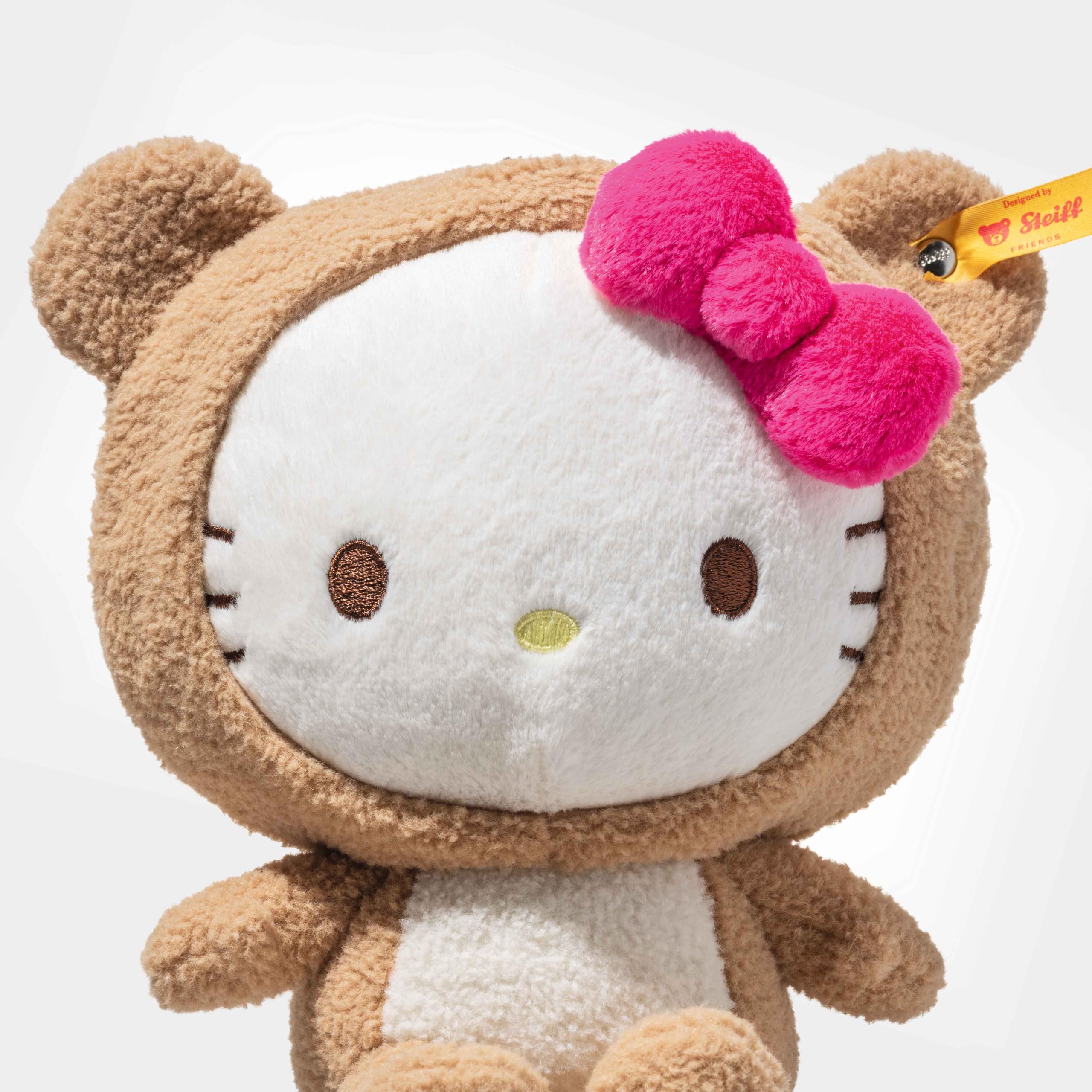 Steiff Hello Kitty w kostiumie pluszowego misia, 20 cm, przytulanka z miękkiego pluszu, odpinany kaptur, pluszowa zabawka, prezent dla dzieci i kolekcjonerów, można prać w pralce