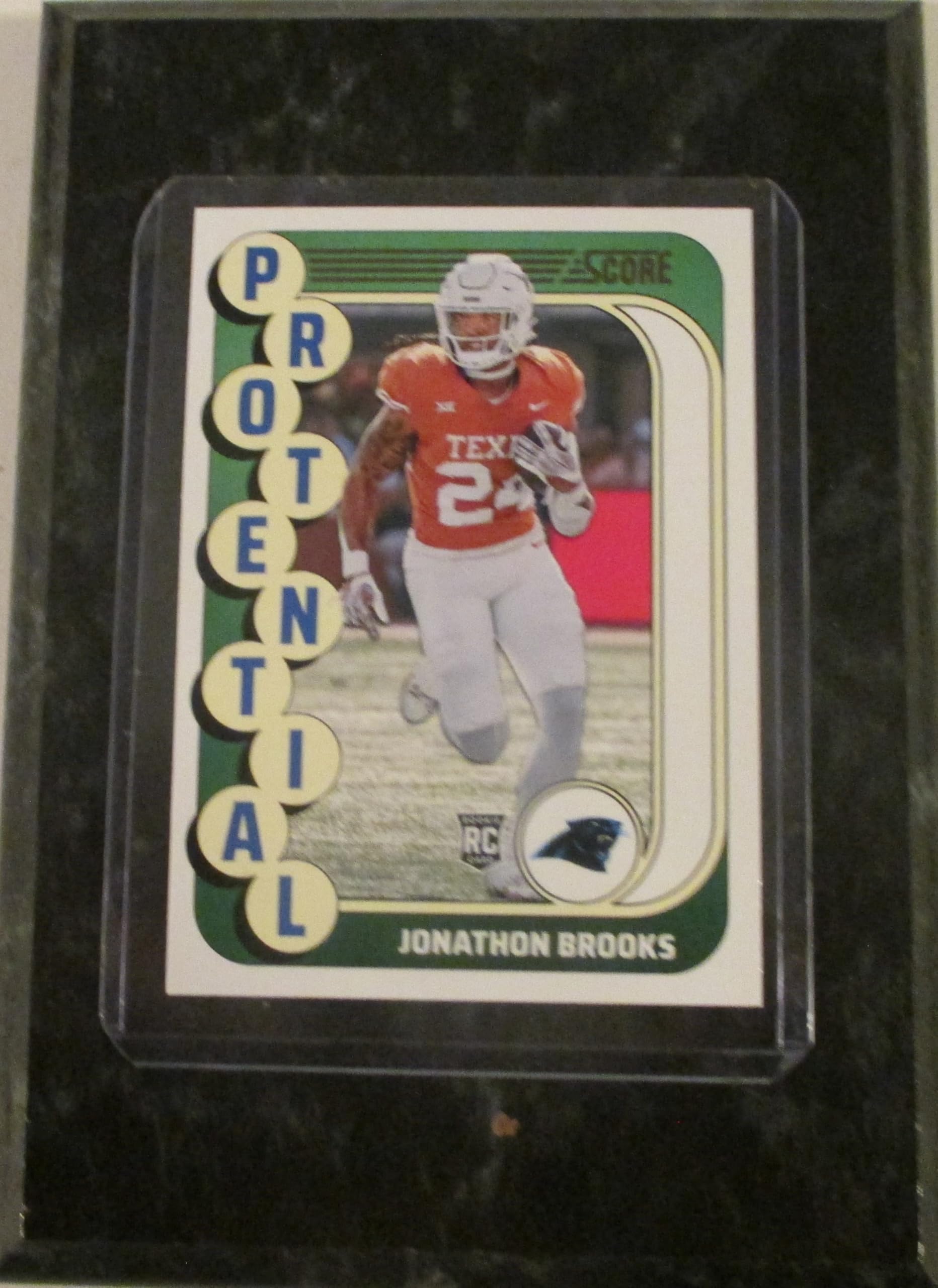 JONATHON BROOKS CAROLINA PROTENTIAL ROOKIE 2024 SCORE FOOTBALL COLLECTIBLE PLAYER CARD MOUNTED ON A 4" X 6" BLACK MARBLE PLAQUE