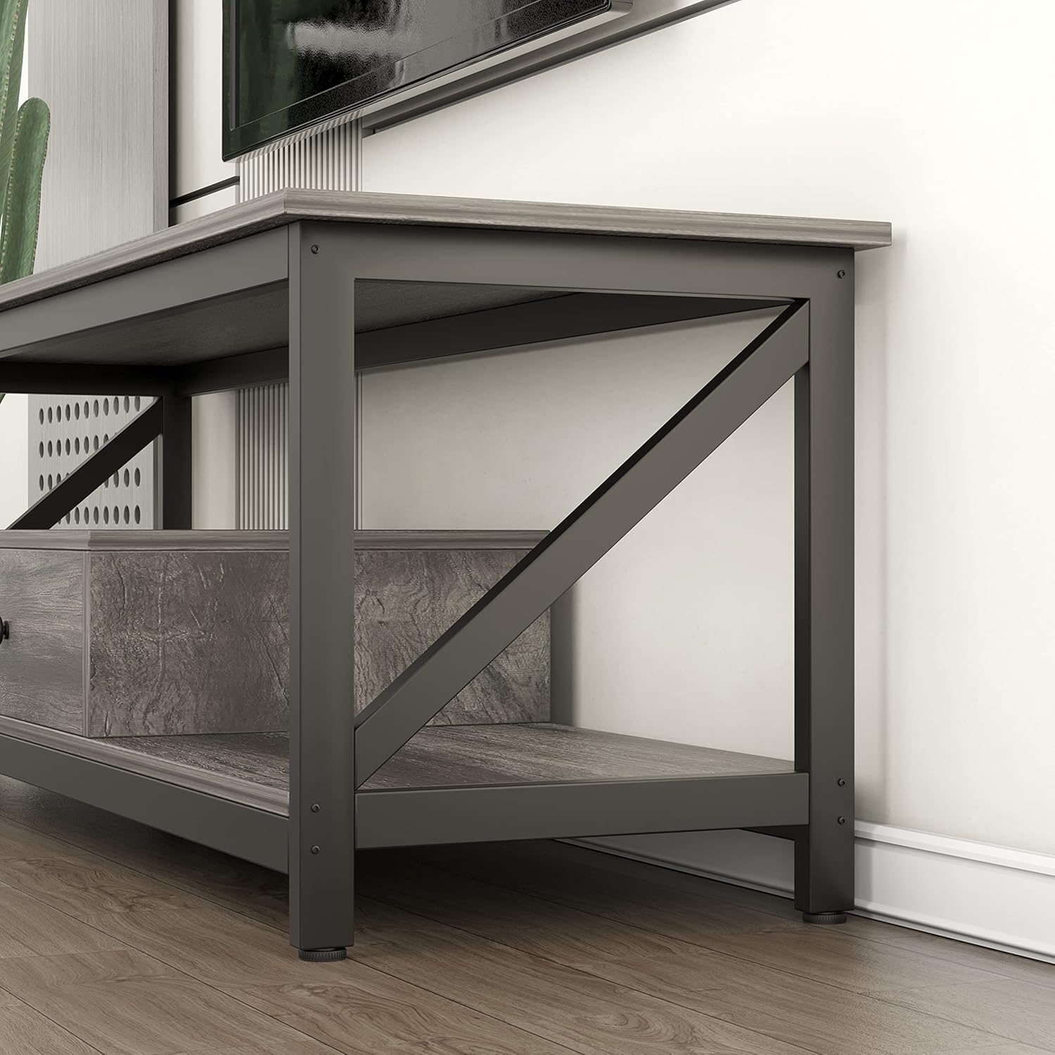 Close-up of the VERMESS TV stand's metal frame and wooden leg base