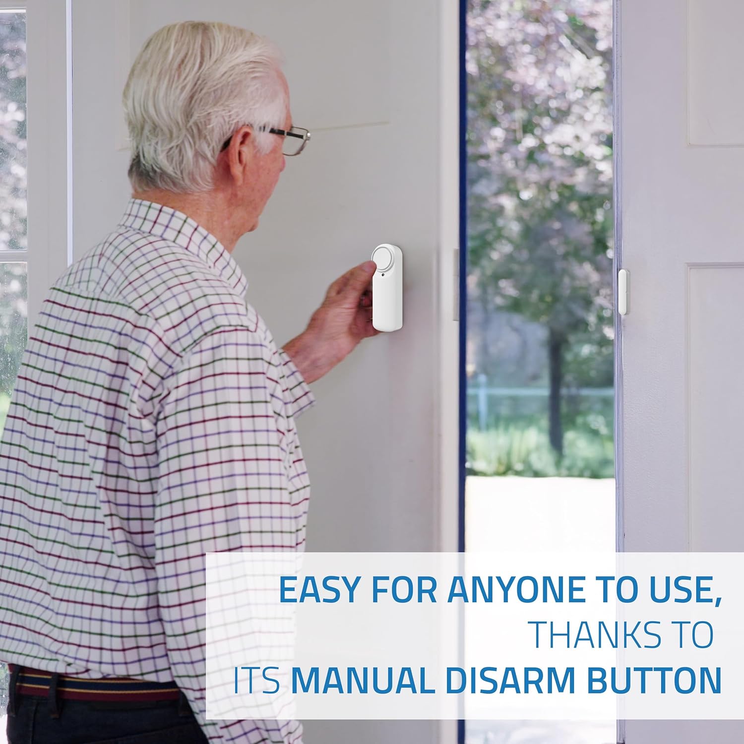 Man using the manual disarm button on the Nivian Smart WiFi Door Alarm sensor.
