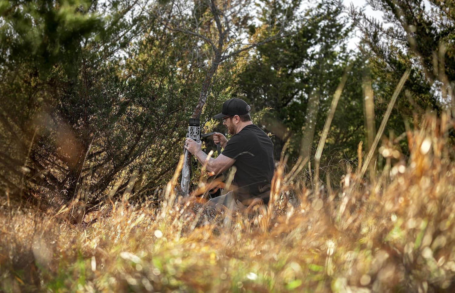 SPYPOINT FORCE-PRO-S camera mounted on a tree