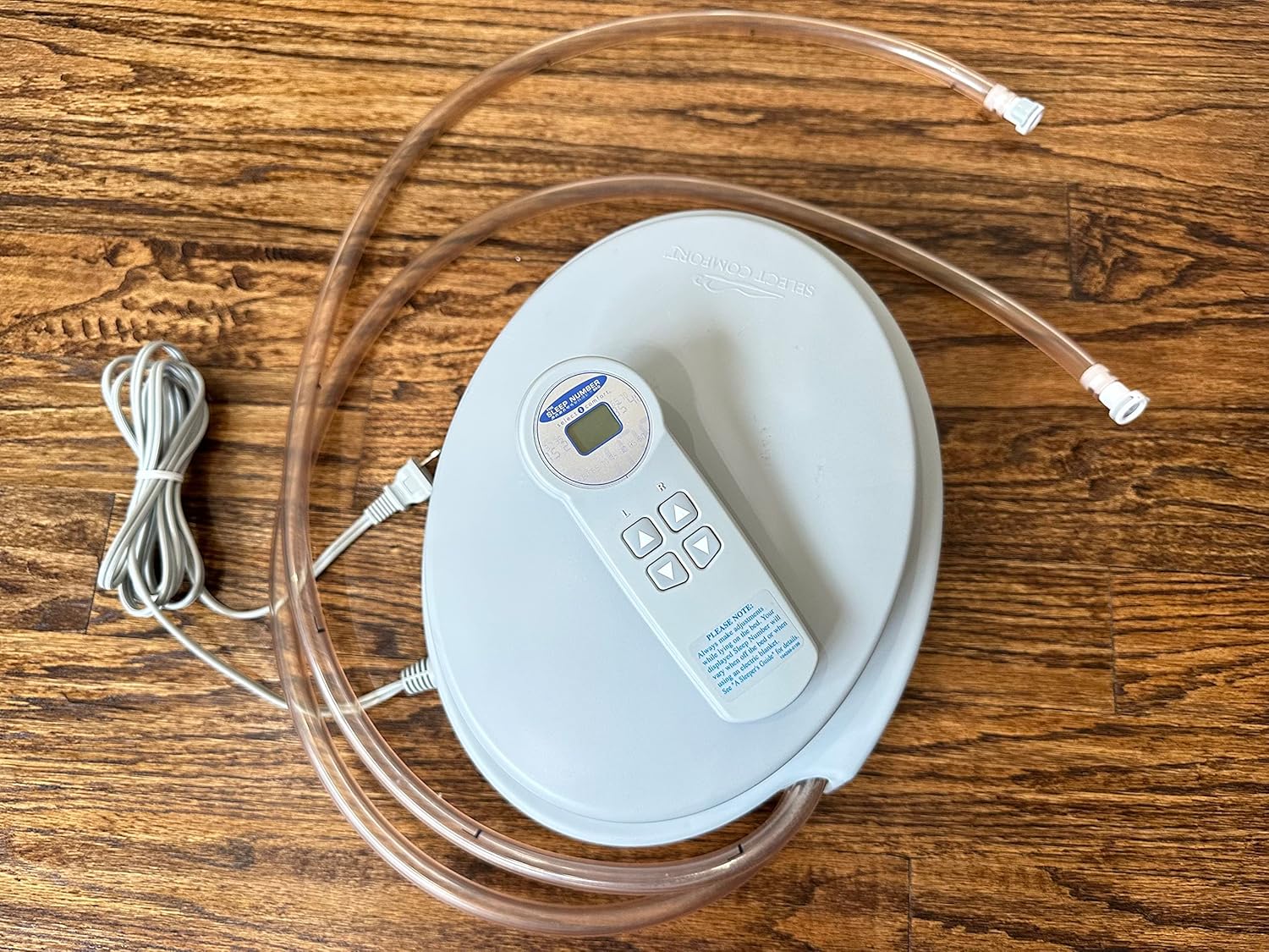 Close-up of Sleep Number Select Comfort Air Pump Replacement with remote