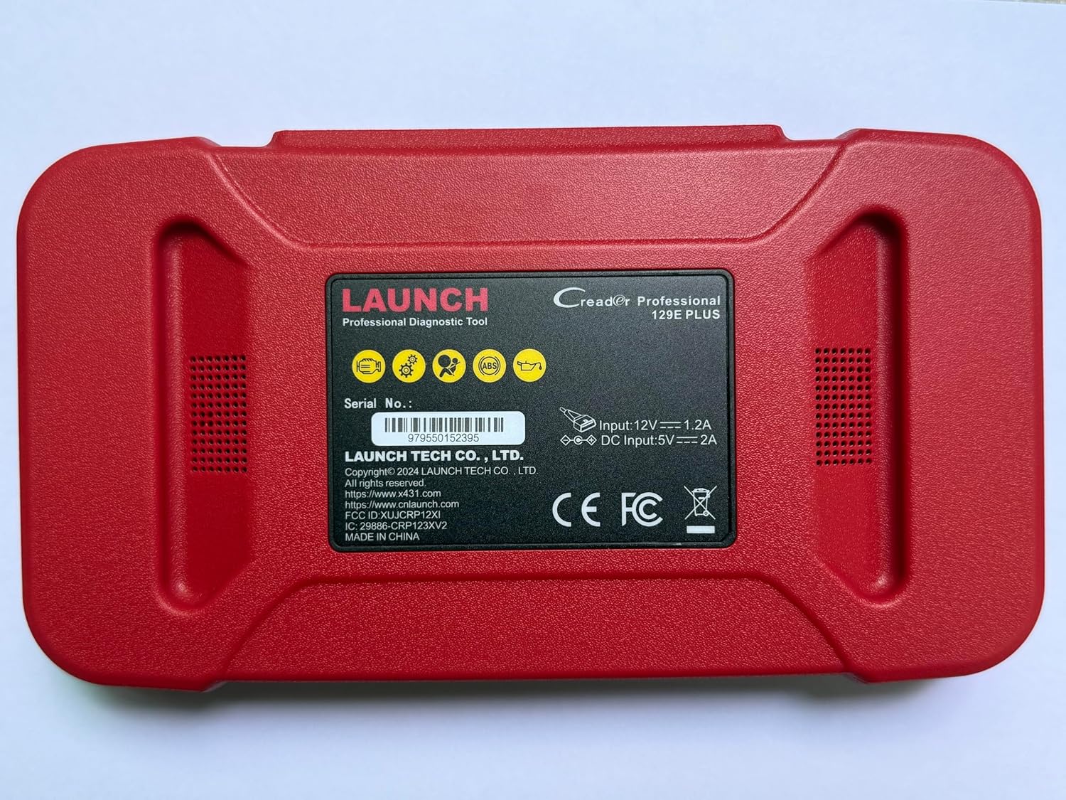 Back of LAUNCH CRP129E Plus device showing serial number and power specifications