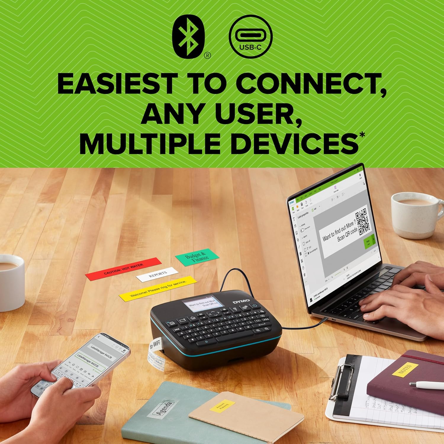 DYMO LabelManager Executive 640 CB connected to a laptop and smartphone, showing various labels