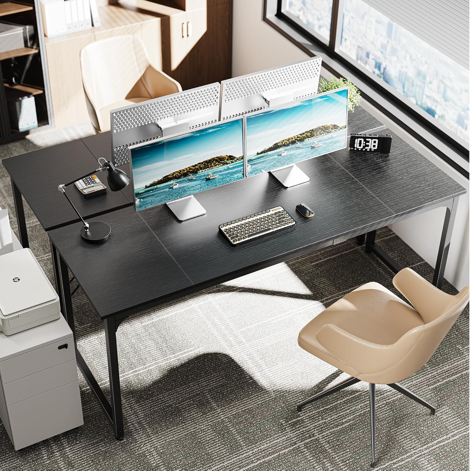 Huuger desk in an office setting with two monitors