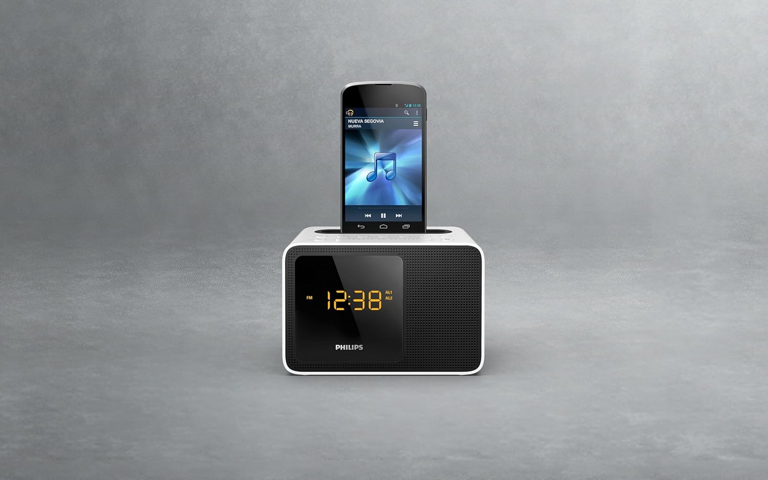 Front view of the Philips AJT5300W/12 clock radio with a smartphone docked in the top slot.