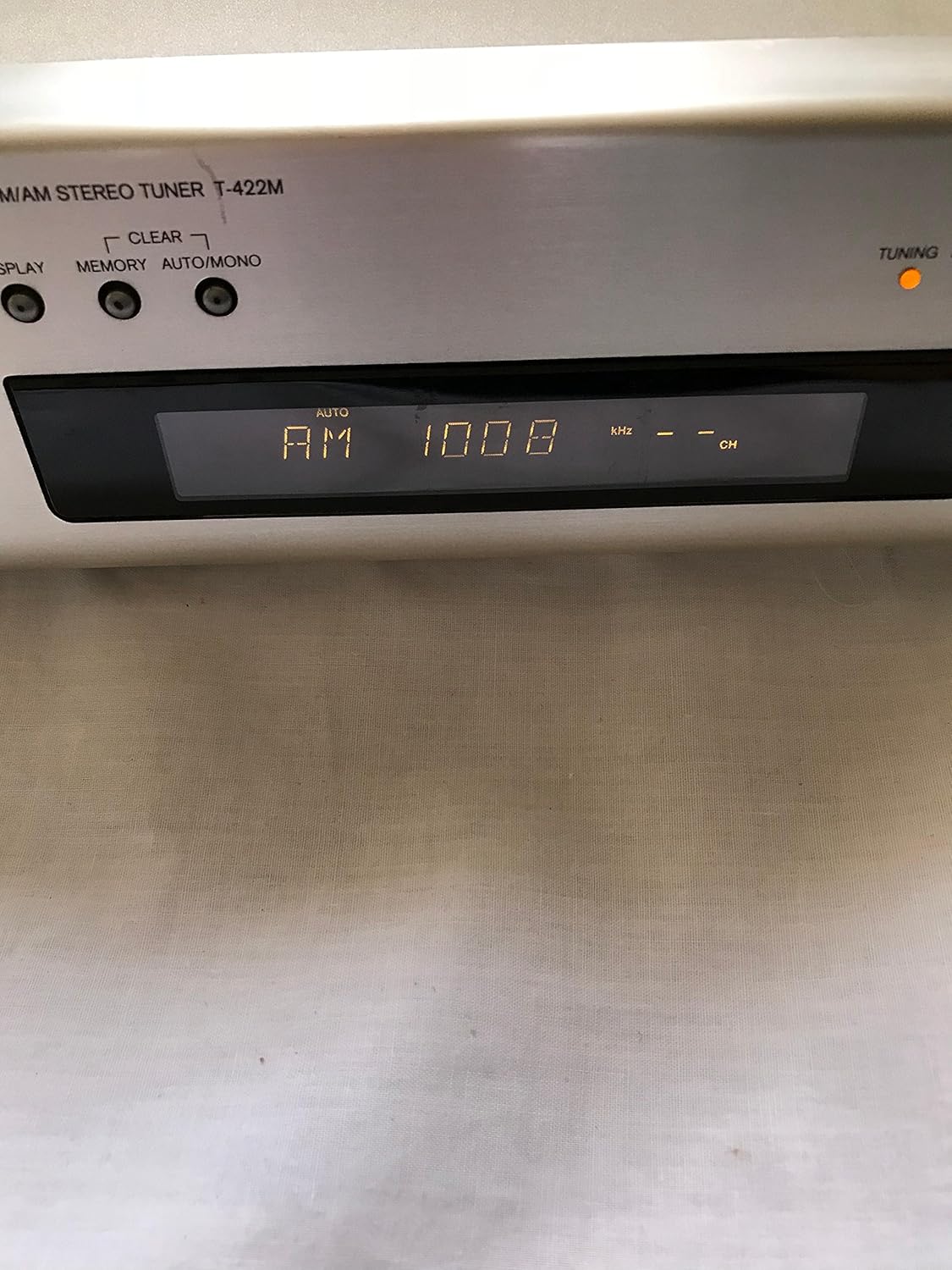Close-up of the ONKYO T-422M(S) Tuner's display showing AM 1008 kHz.