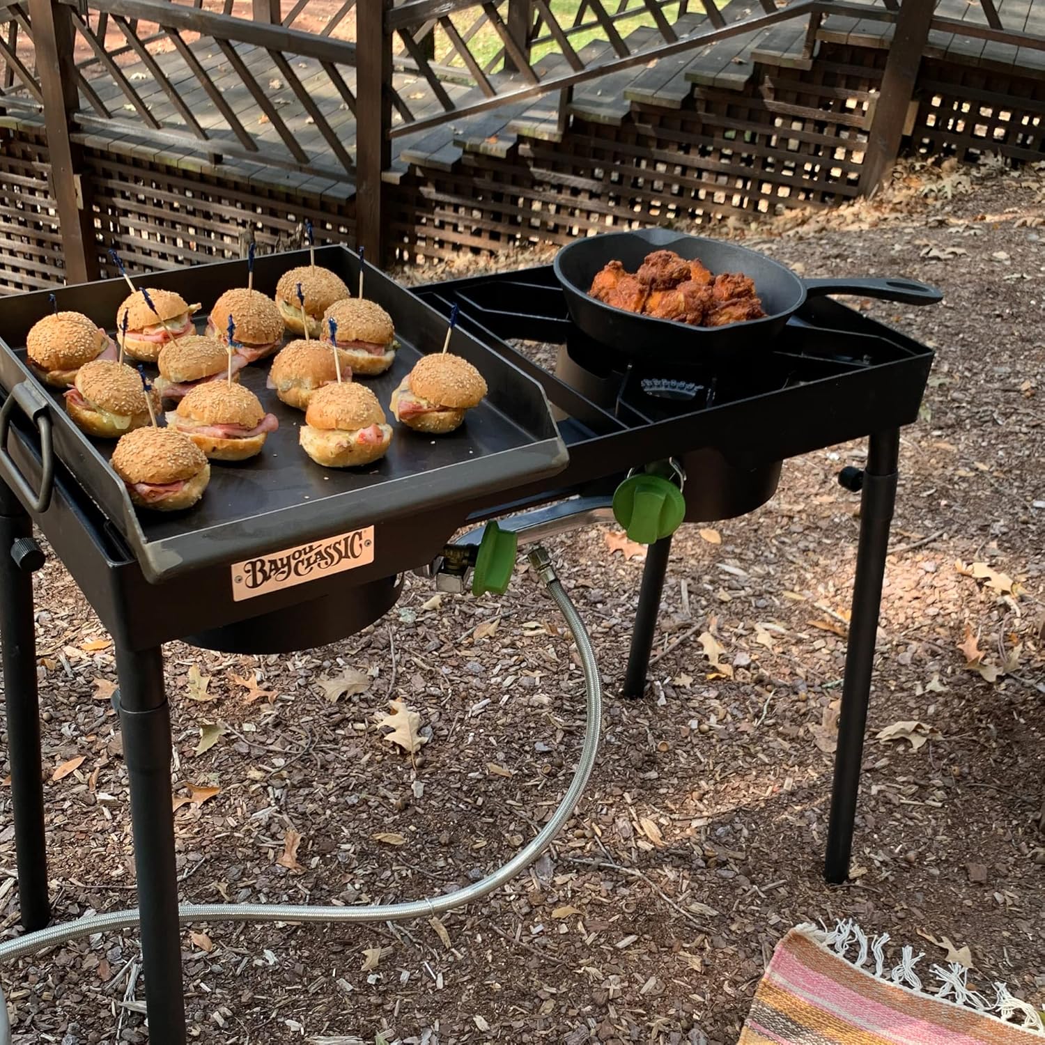 Bayou Classic Dual Patio Camp Stove w/Single Griddle Features Dual 6-in Cast Aluminum Burners 27-in Tall Cooker 13.5-in x 13.5-in Square Removable Griddle Perfect For Backyard Chefs Tailgates