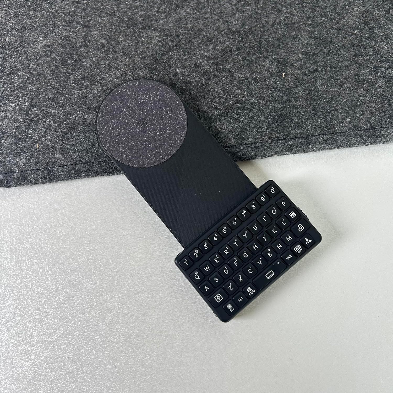 EXknight Mini Bluetooth Keyboard attached to magnetic backplate