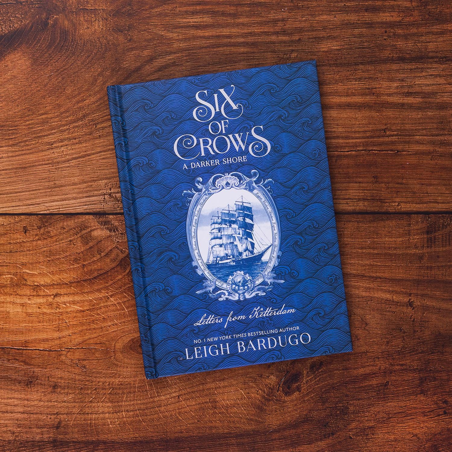 Six of Crows: A Darker Shore: Letters from Ketterdam: an instant No. 1 New York Times bestseller