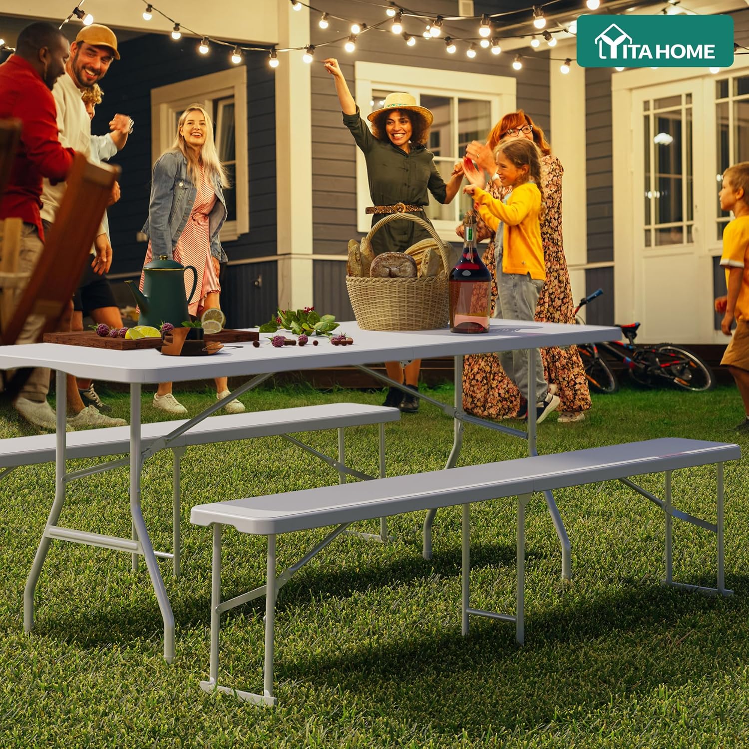 YITAHOME folding bench set up at an outdoor evening gathering with people
