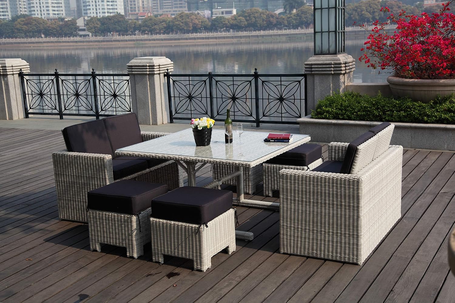 Robinson Outdoor Collection, 7 Pieces: Two Love Seats, One Dining Table and 4 Stools. Structure in White PE Wicker, Seats and Backs Cushions in Dark Grey. Table Top in Tempered Glass.