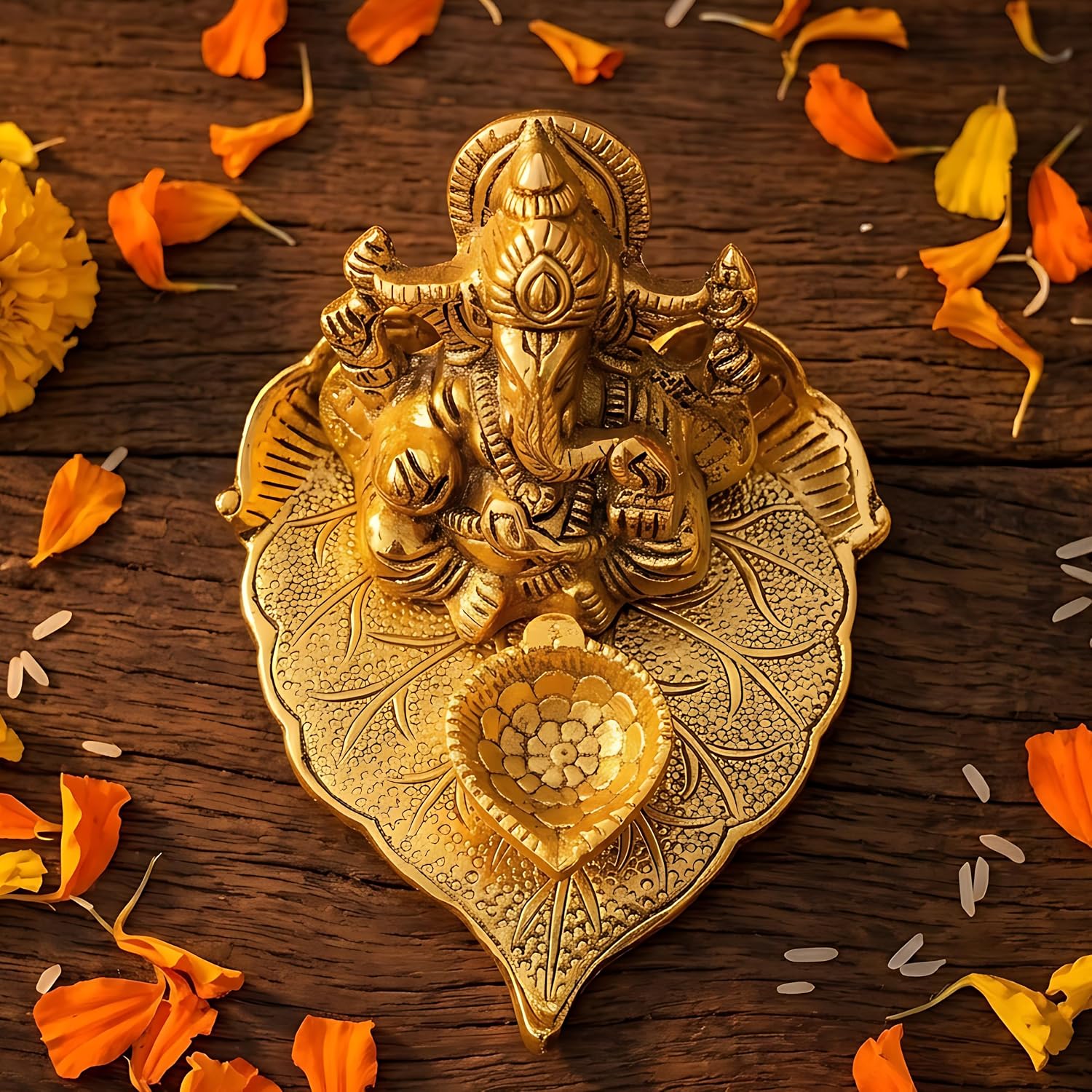 TIED RIBBONS Ganesh Metal Diya, 2.5 Inch | Golden Lord Ganesh Sitting on Paan Leaf Design Oil Lamp | Puja Diya for Diwali Decorations, Ganesh Chaturthi, Temple, Indian Return Gifts