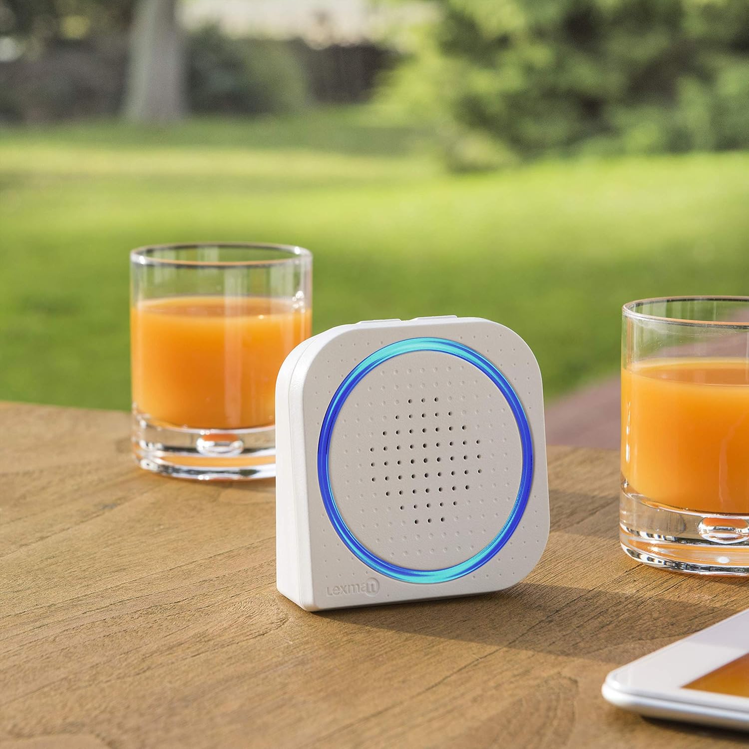 LEXMAN chime unit clipped to a person's jeans belt loop