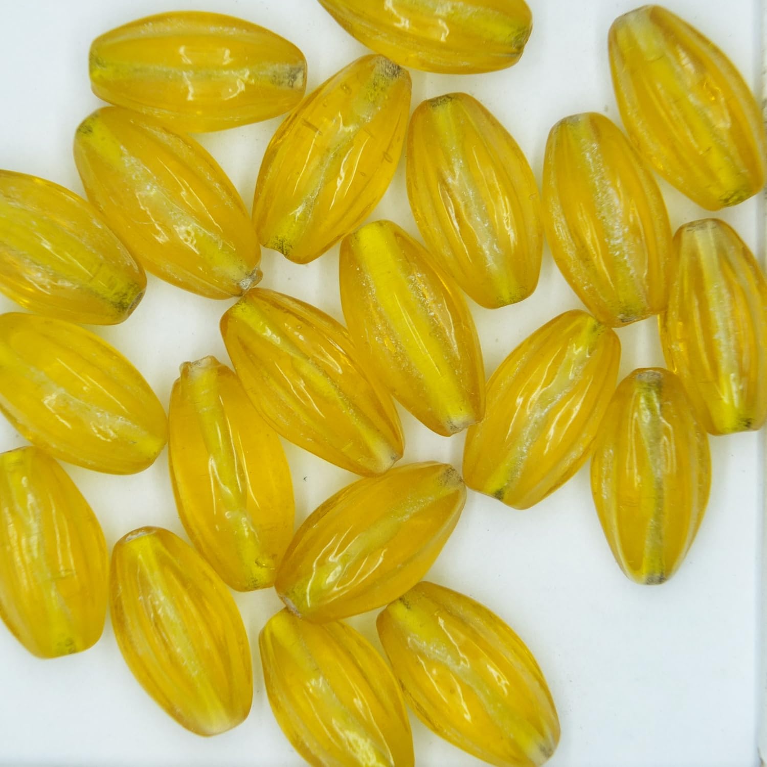 Glass Beads Yellow Transparent Fluted Oval 15mm. Pack of 20