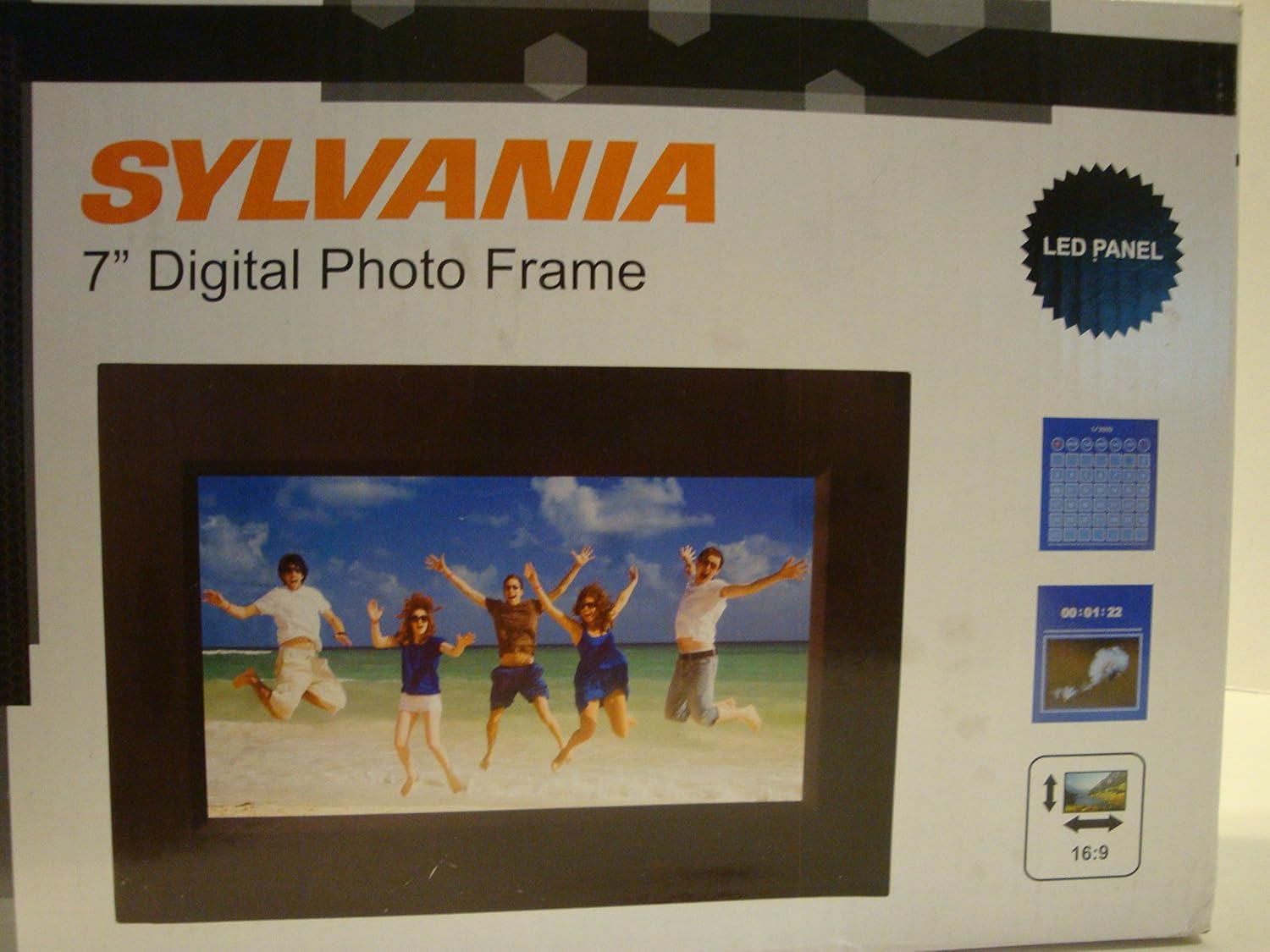 Close-up of a hand inserting a memory card into the side slot of a digital photo frame, labeled '2) Insert appropriate memory card into digital photo frame'.