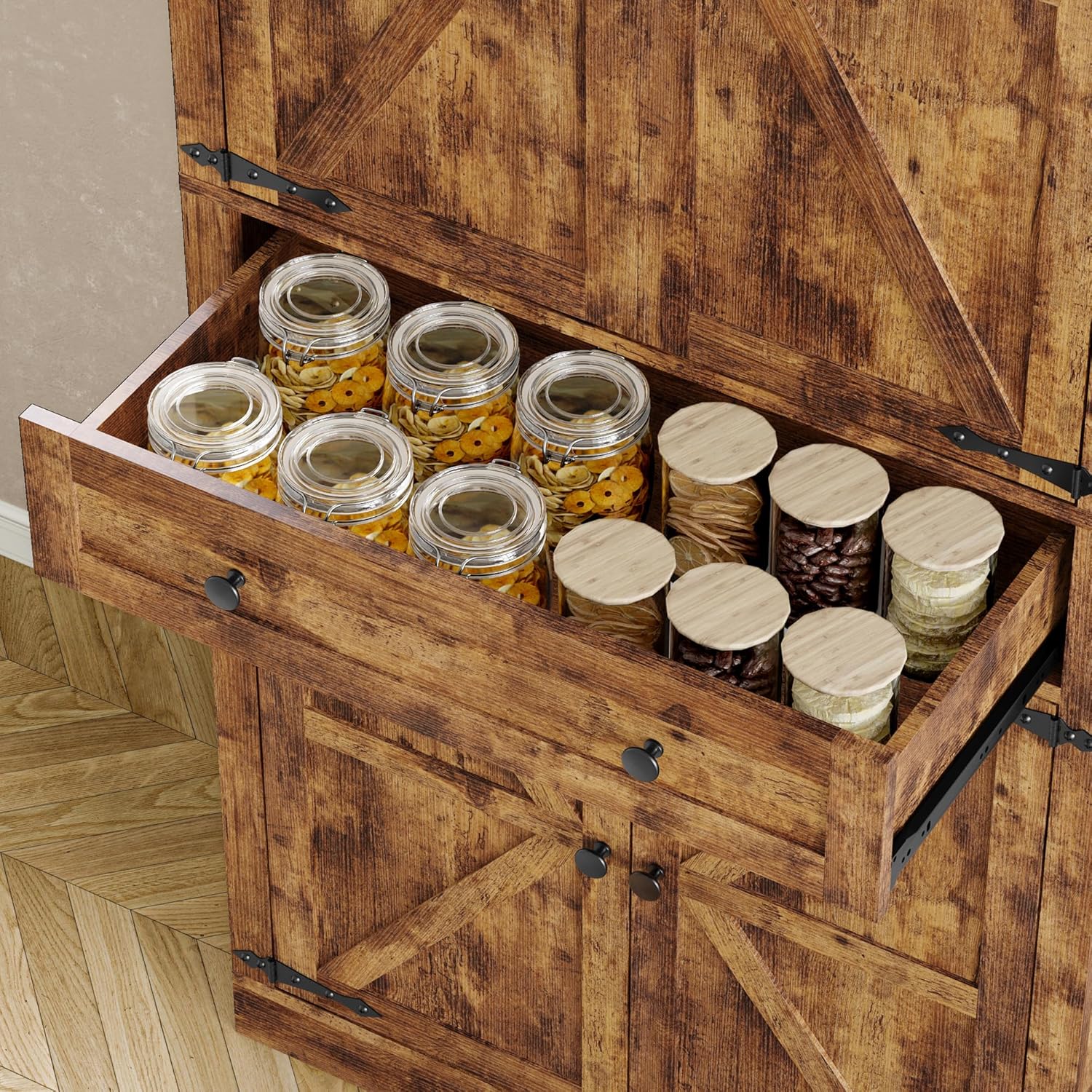 Close-up of the open single drawer of the pantry cabinet, filled with jars of spices and other small items.
