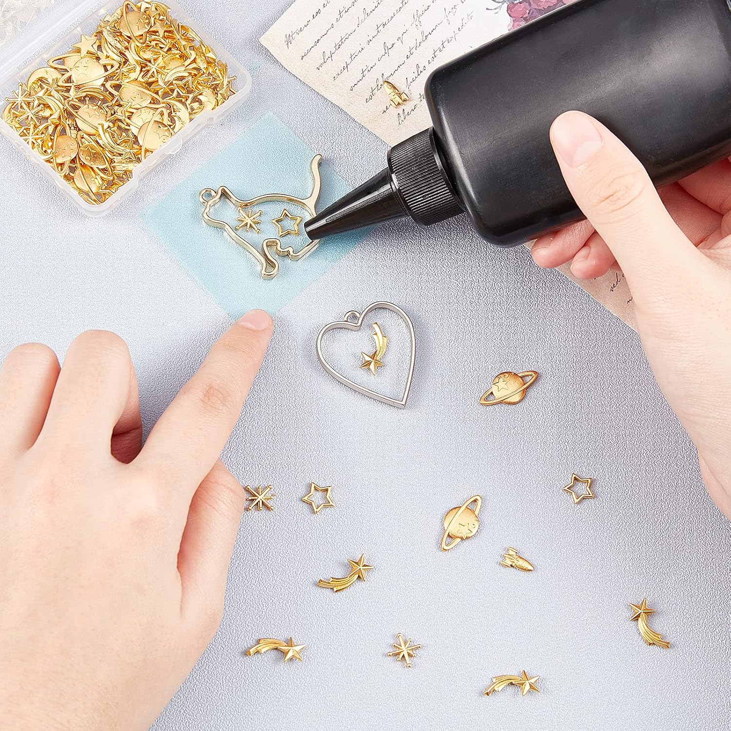 OLYCRAFT 112pcs Cosmos Themed Resin Fillers Resin Charms Alloy Epoxy Resin Supplies Planets Star Moon Rocket Filling Accessories Slime Charms for Resin Jewelry Making -Golden