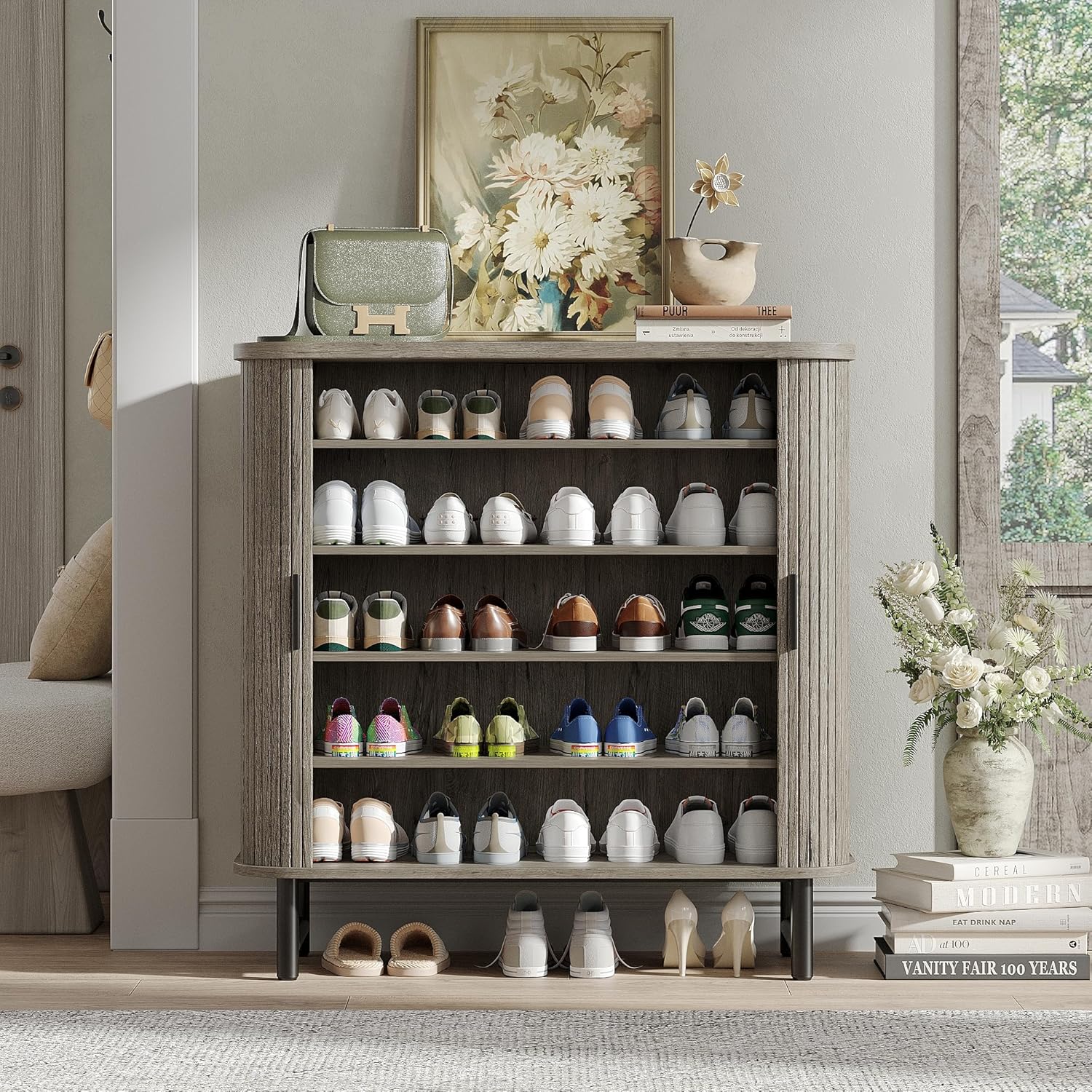 Image of the shoe cabinet with doors open, displaying various shoes stored on its shelves.