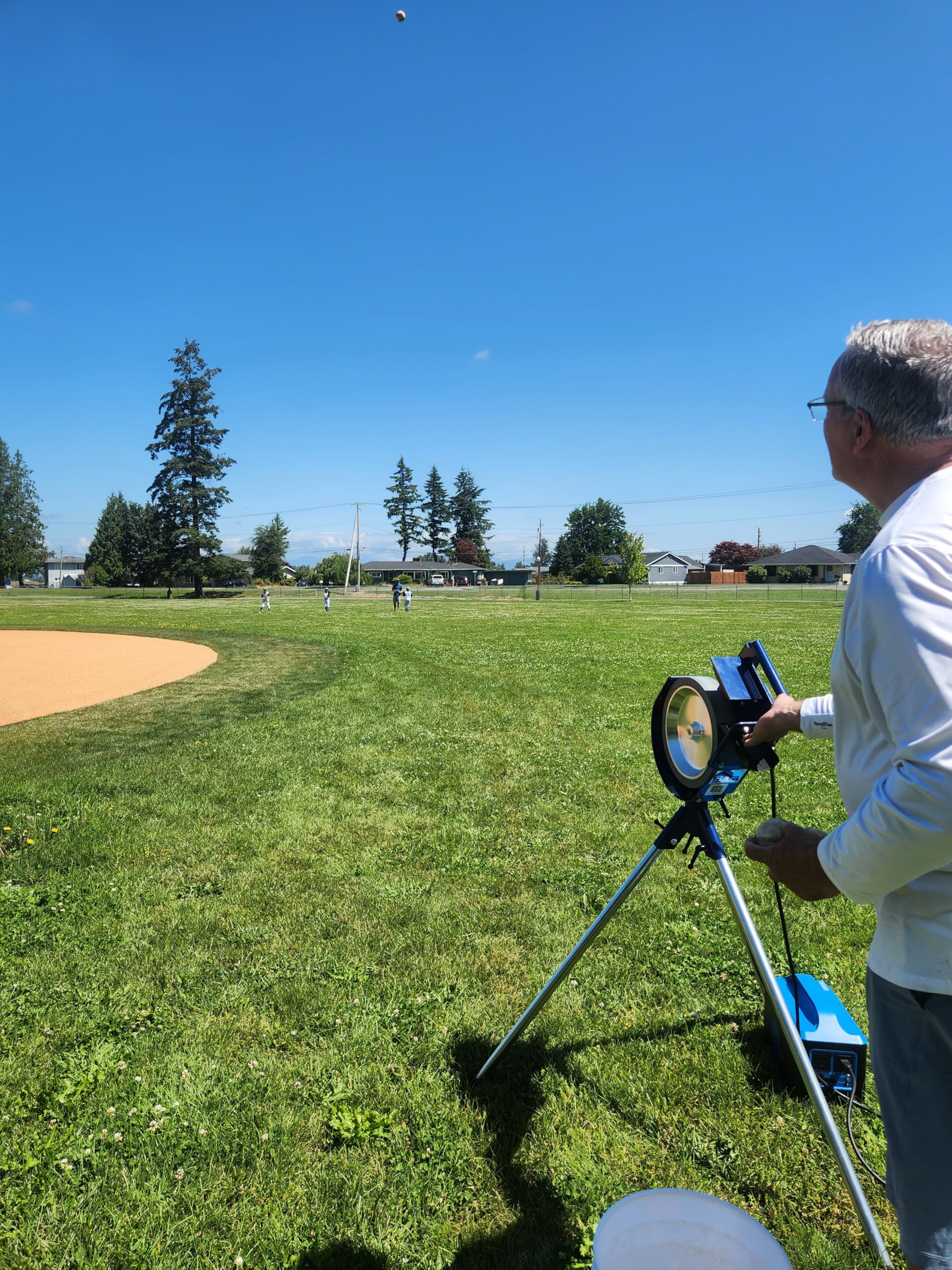 BATA B1 Baseball and Softball Combo Single Wheel Pitching Machine Bundle, Includes 9 Inch Low Seam Baseballs, 12 Inch Low Dimpled Softballs, and Pitch Machine Cover