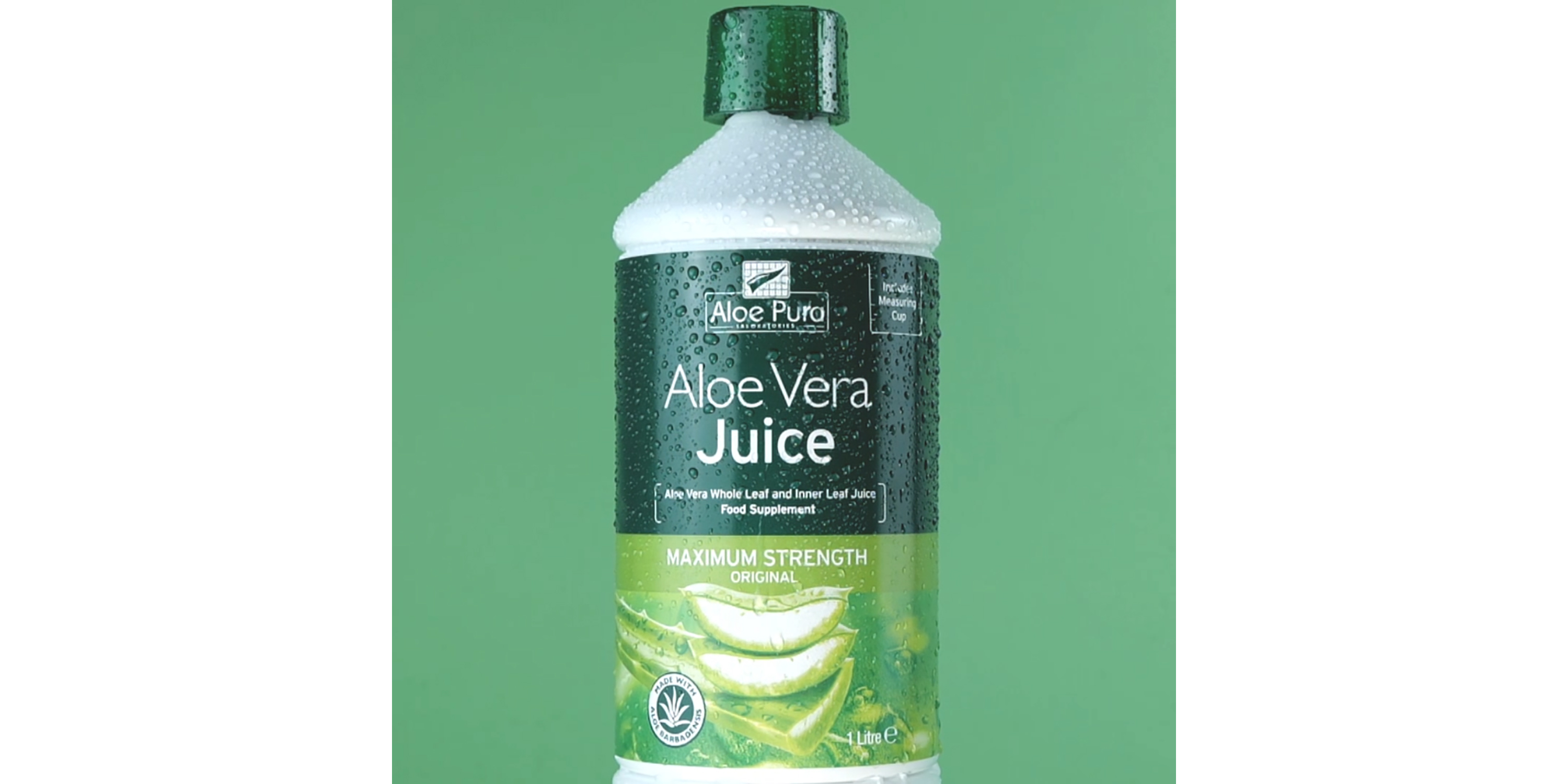 Bottle of Aloe Pura Aloe Vera Juice with label indicating whole leaf and inner leaf juice, shown against a green background.