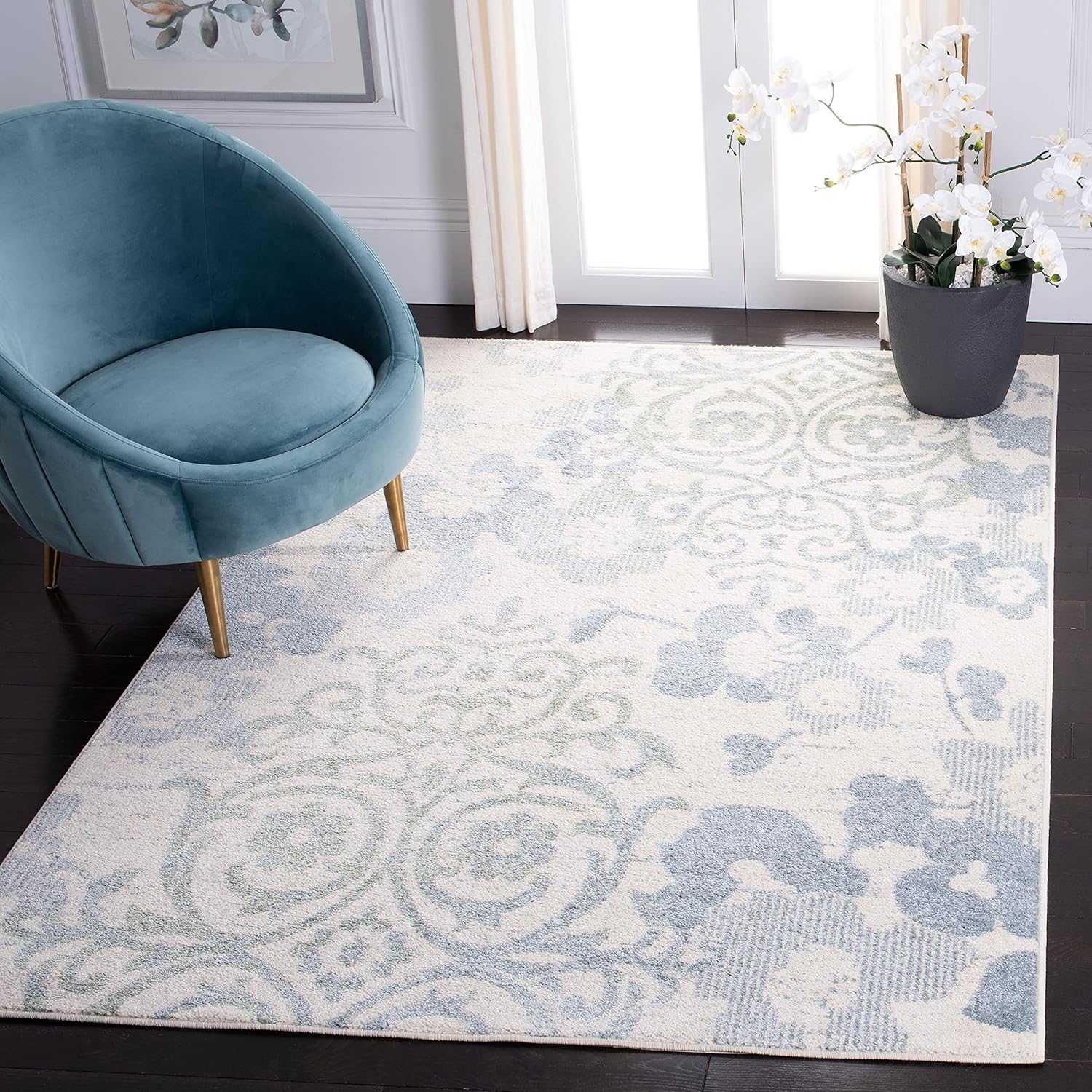 Ivory and Blue Floral Synthetic 6' x 9' Area Rug