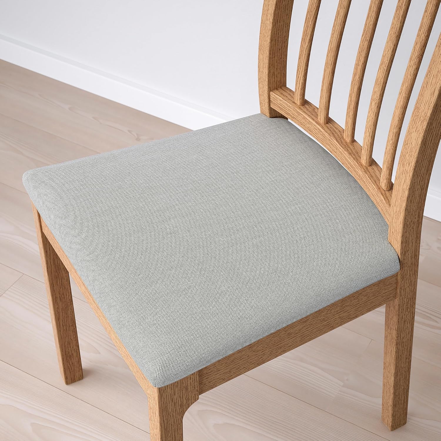 Close-up of the light grey upholstered seat fabric