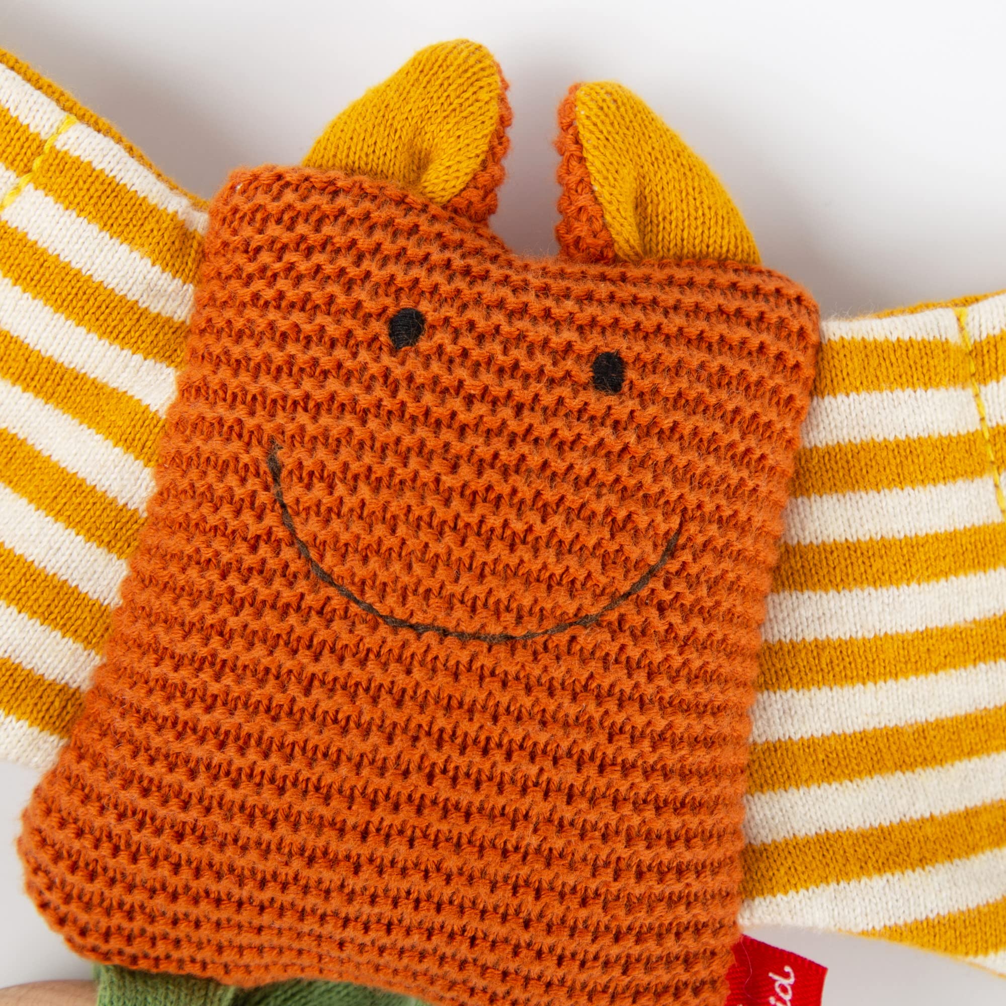 SIGIKID 39673 - Mazza a maglia per bambini, in maglia di cotone, con anello in legno e sonaglio, per afferrare, ascoltare e giocare per bambini da 3 a 12 mesi, arancione, 8 x 34 x 3 cm