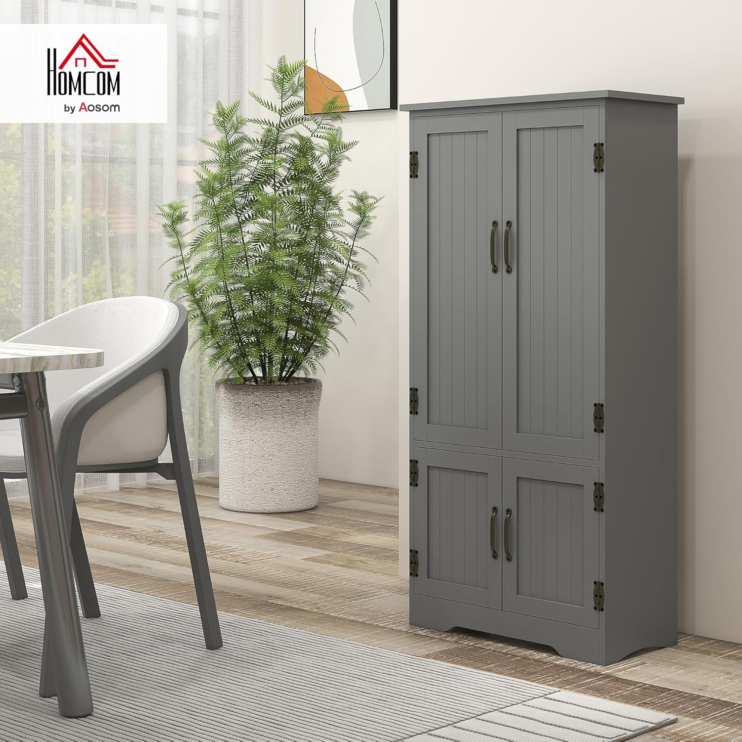 Fully assembled HOMCOM 48.5-inch Kitchen Pantry Cabinet in grey, with all four beadboard doors closed, standing in a dining room setting.