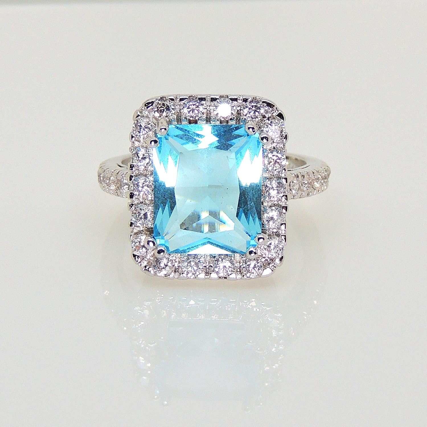 Gina Statement Ring for Women by Ginger Lyne | Simulated Blue Topaz Exaggerated 6 Carat Radiant Cut Fashion Ring for Her | Gifts for Mom or Grandmother