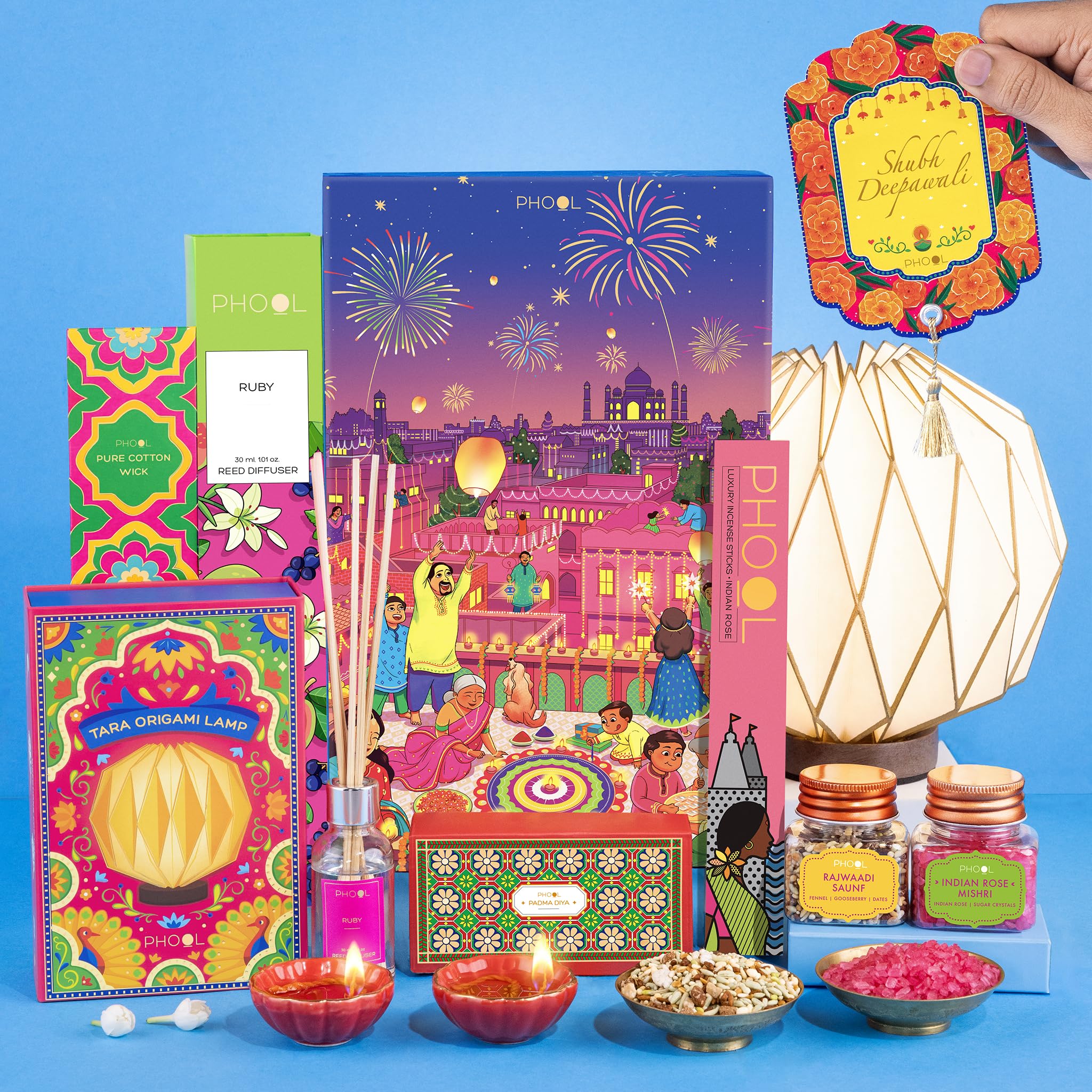 Phool Diwali Nostalgia Gift Hamper - 9 Pack - Includes Tara Sitara Lamp, Ruby Reed Diffuser, Gold & Red, Ceramic Diya, Phool incense sticks, Rajwadi Saunf & Rose Mishri, Diwali greetings card and Cotton wick - Diwali hamper gift box