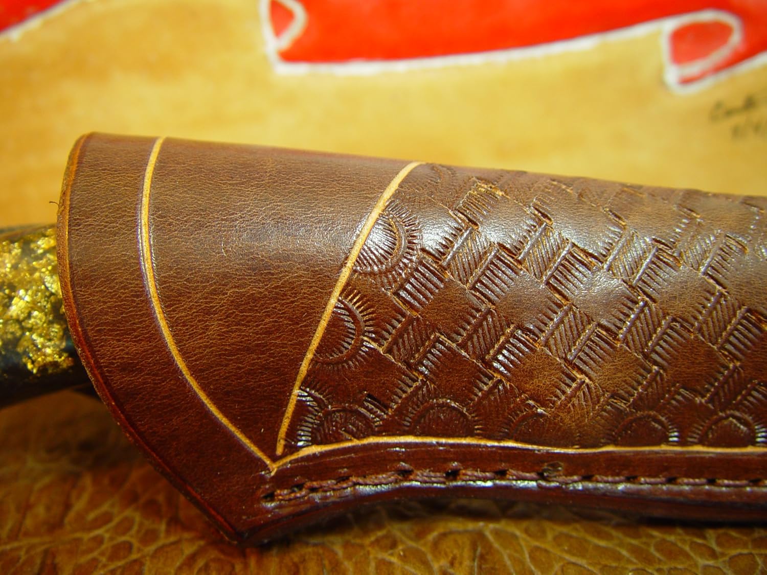 Custom Leather Knife Sheath Size 7f. The Sheath I s Made Out of 10 Ounce Water Buffalo Leather Dyed Light Brown with a Basket Weave Tooling.