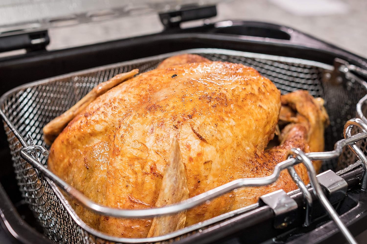 Cooked turkey in the fryer basket